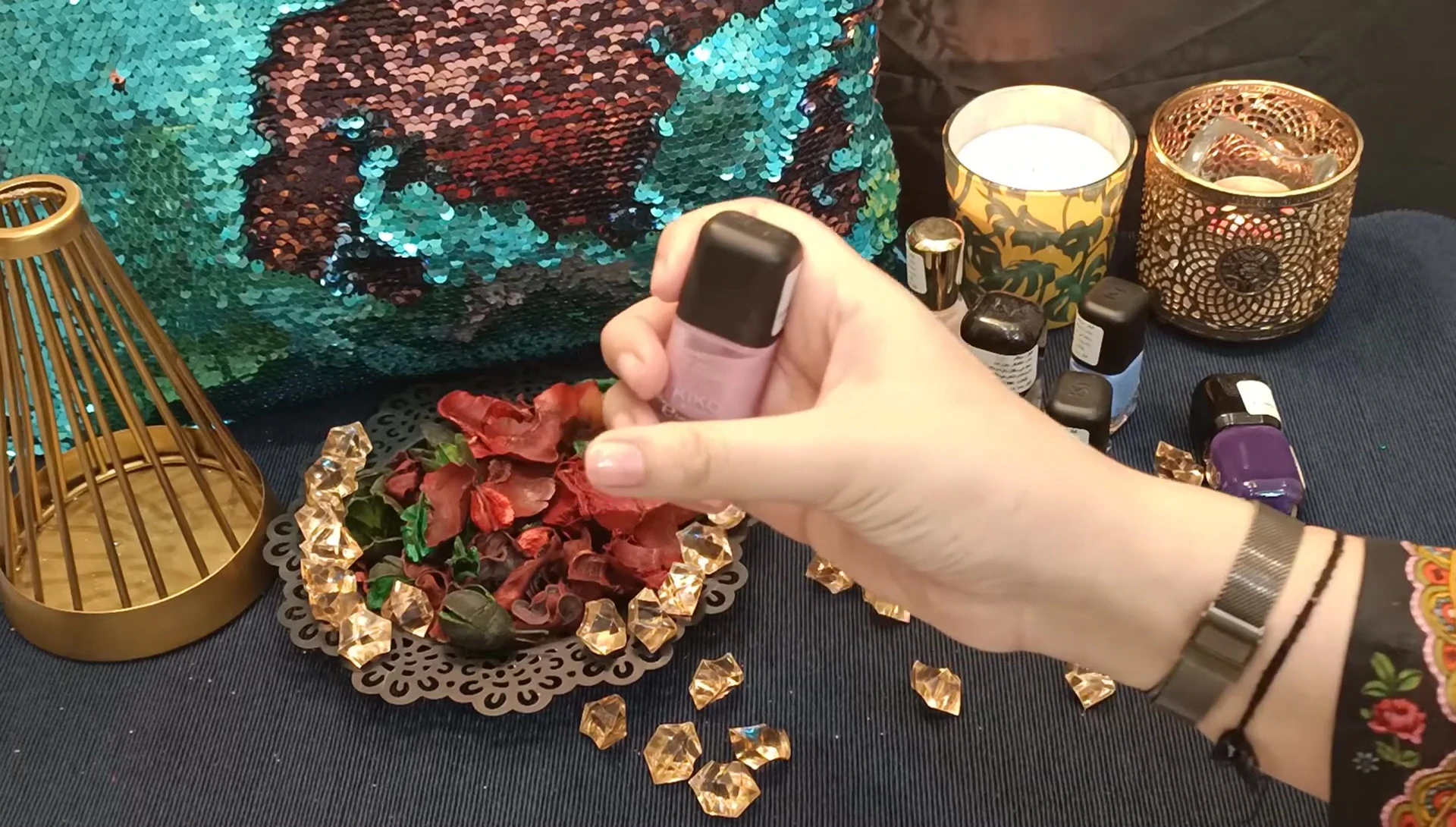 Another view of the light pink nail polish on nails.