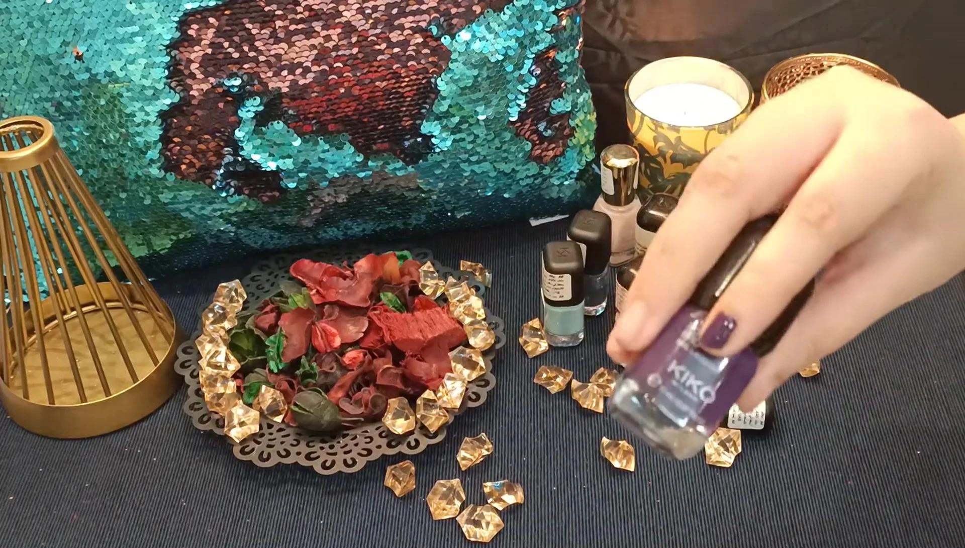 The dark purple nail polish applied to nails.