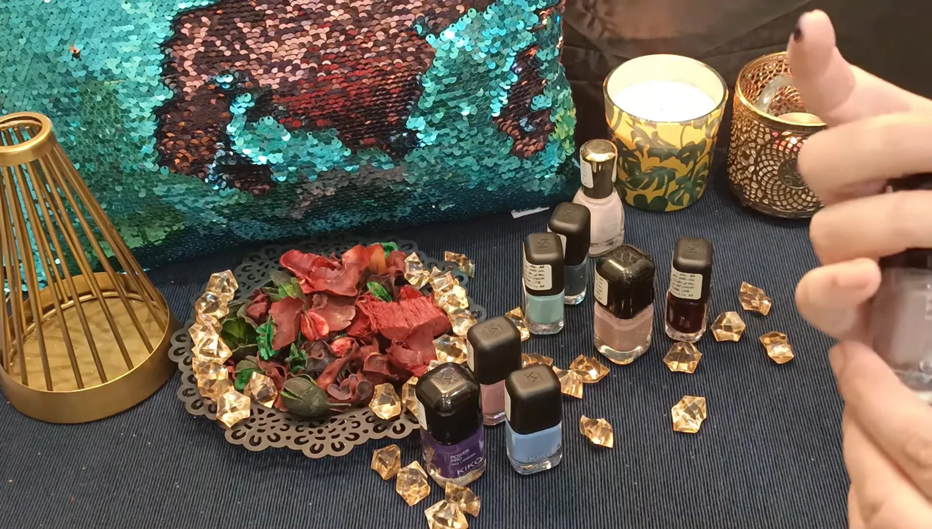 The lighter shade of nail polish on the nails