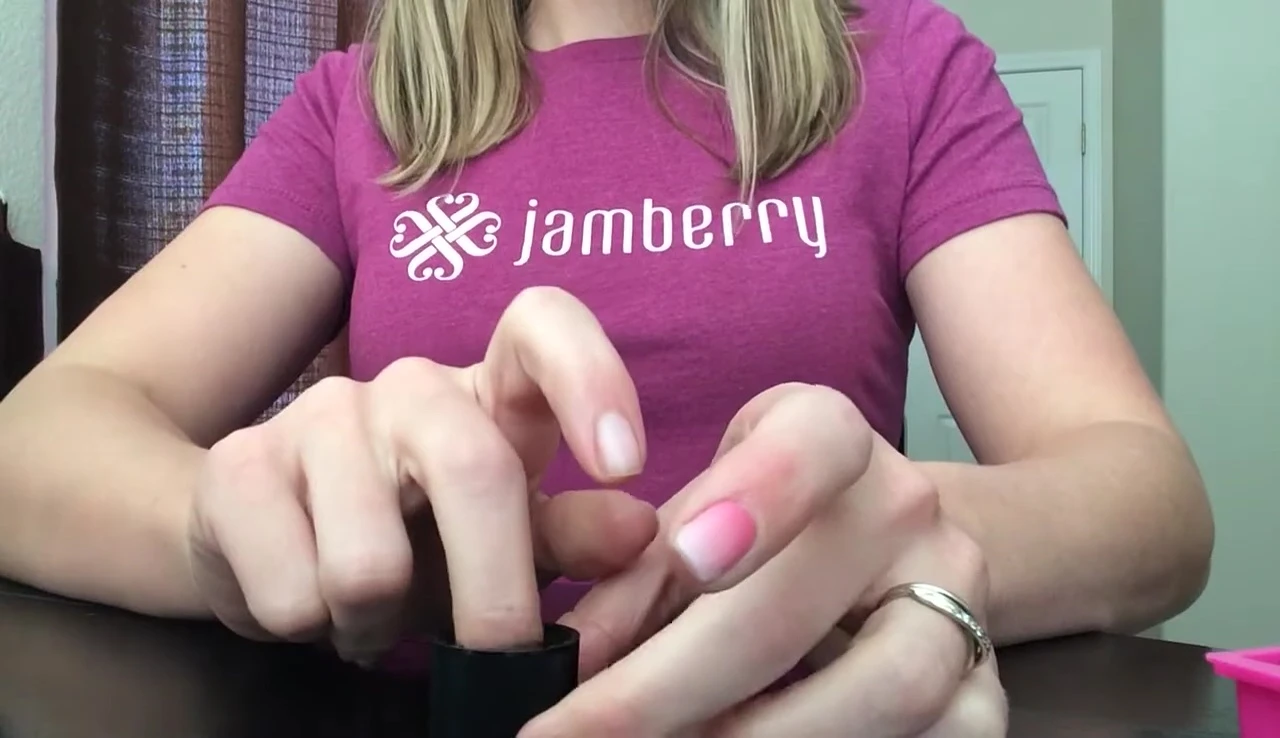 Soaking the edge of the nail wrap in nail polish remover.