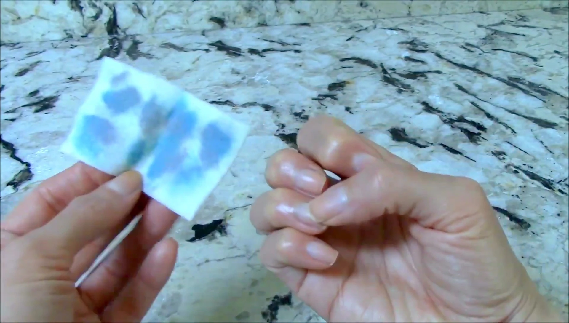 The reviewer shows her hands after using the pads