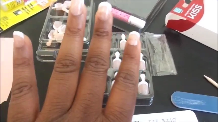 Final shot showcasing the nails and the product packaging.