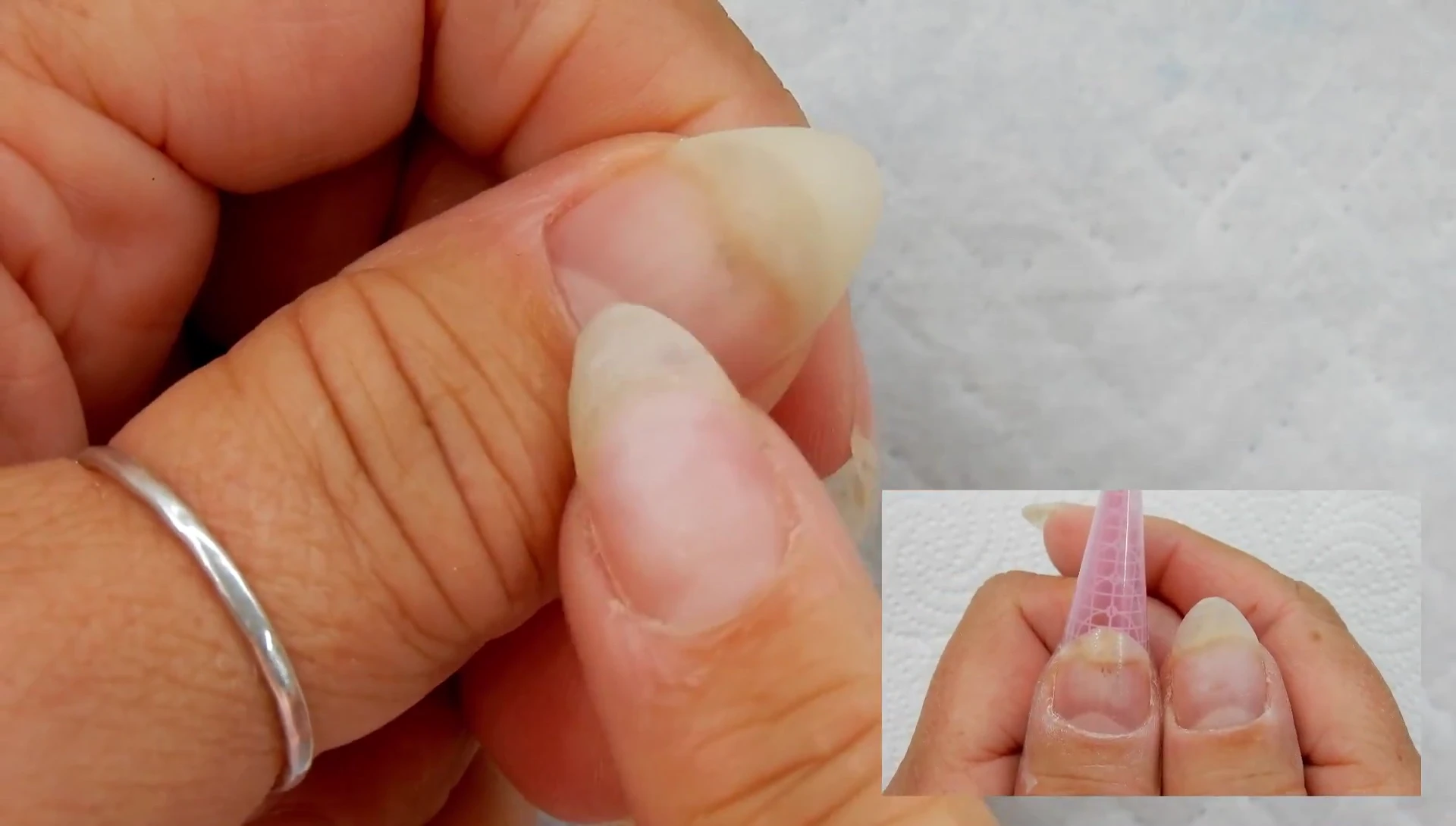 The reviewer's nail with a hard gel overlay