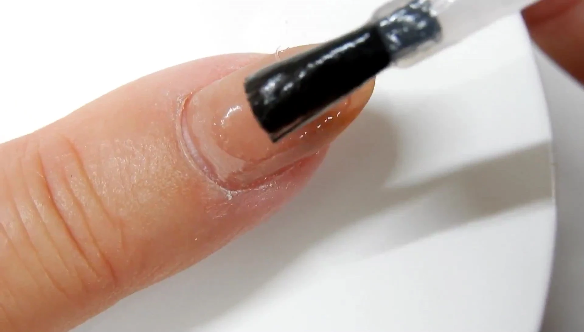 Applying Magic Remover to natural nail