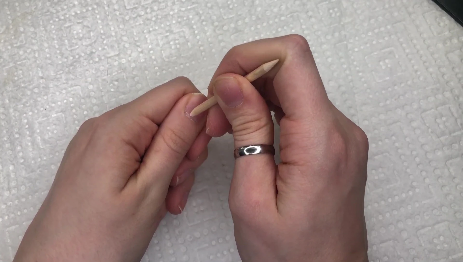 Pushing back cuticles with the included tool