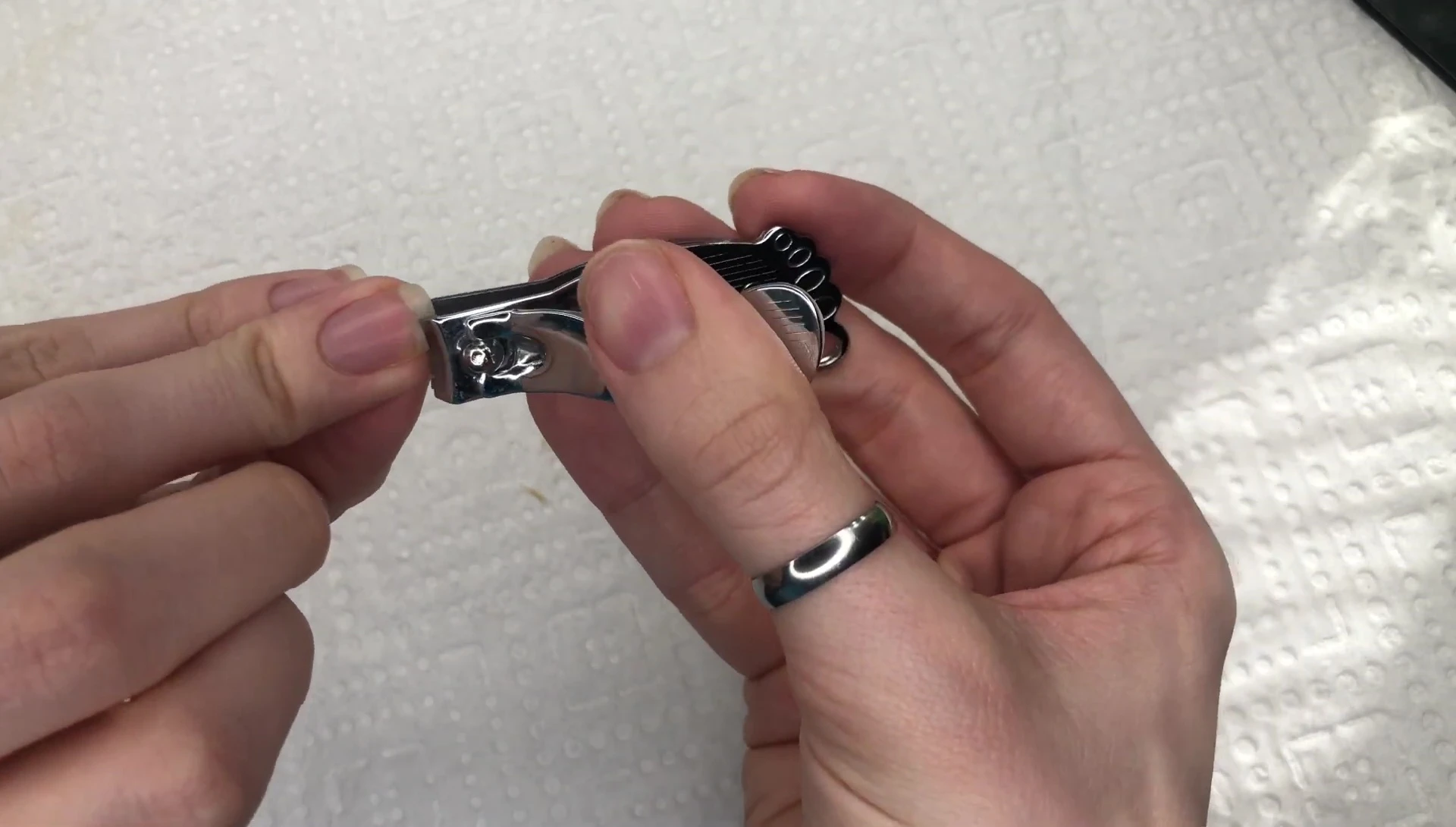 Filing down the corners of natural nails