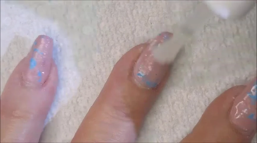 Applying the gel remover to a nail.