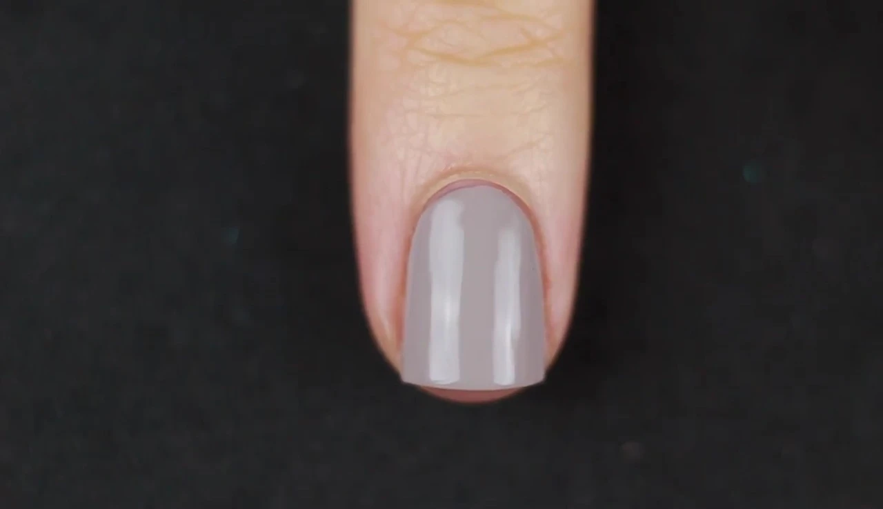Close-up of Waking Up in Vegas polish applied to nail