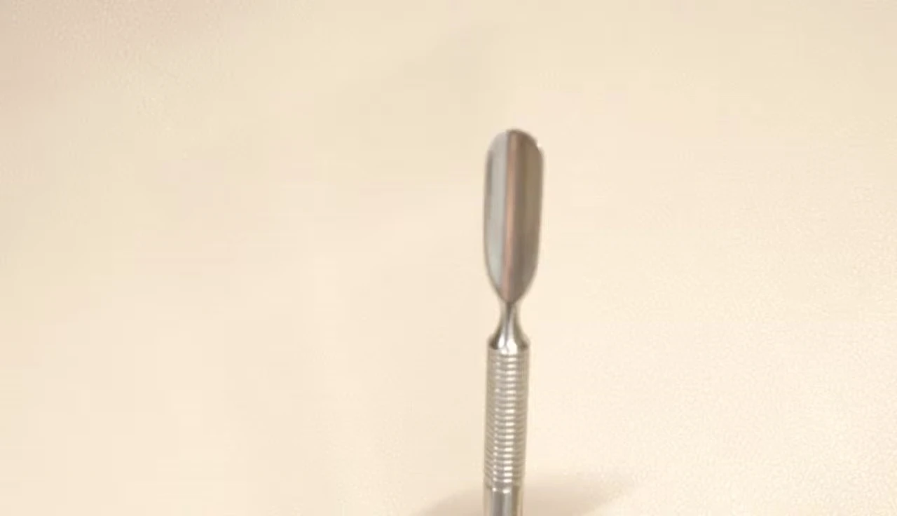 Close-up of the generic cuticle pusher, showing both the scraping and pushing ends.