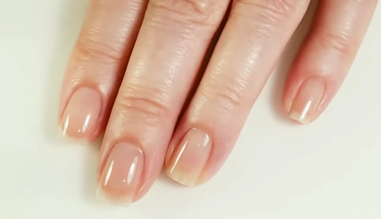 Close-up of the reviewer's nails showing the strengthener's application and durability.