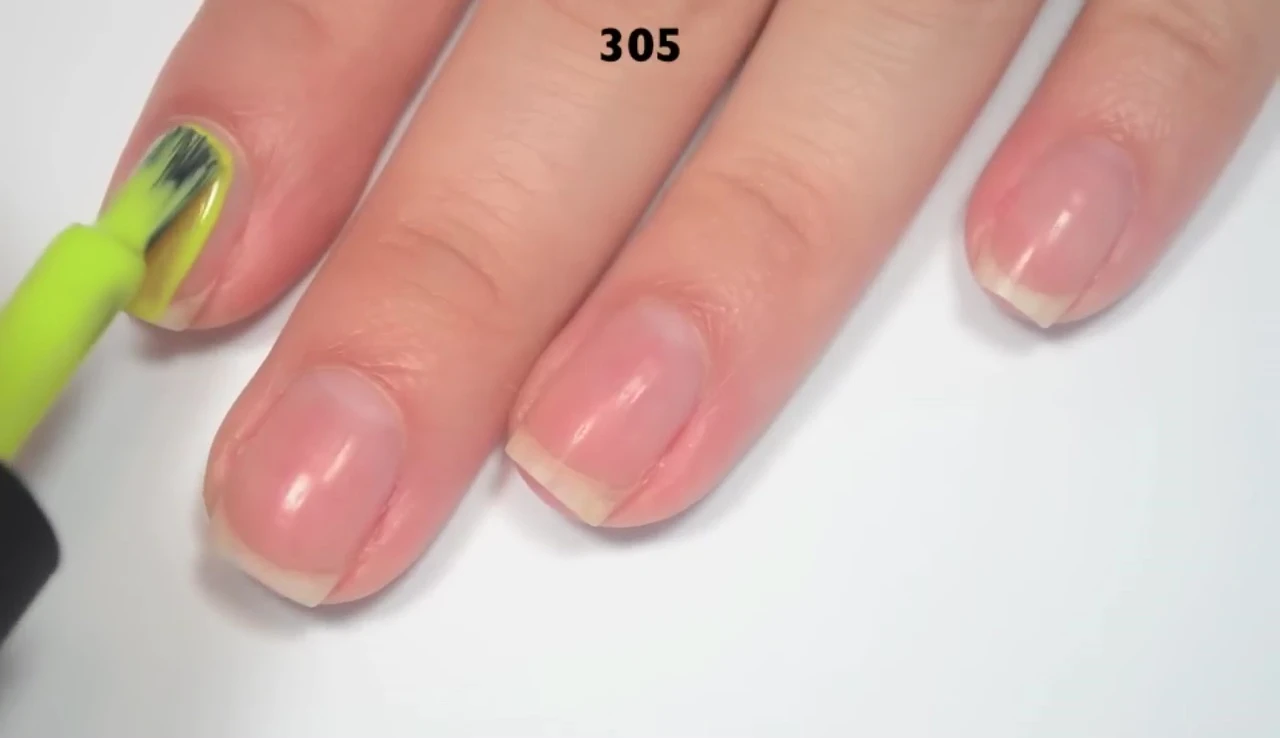 One coat of 305, sheer and showing yellow undertone