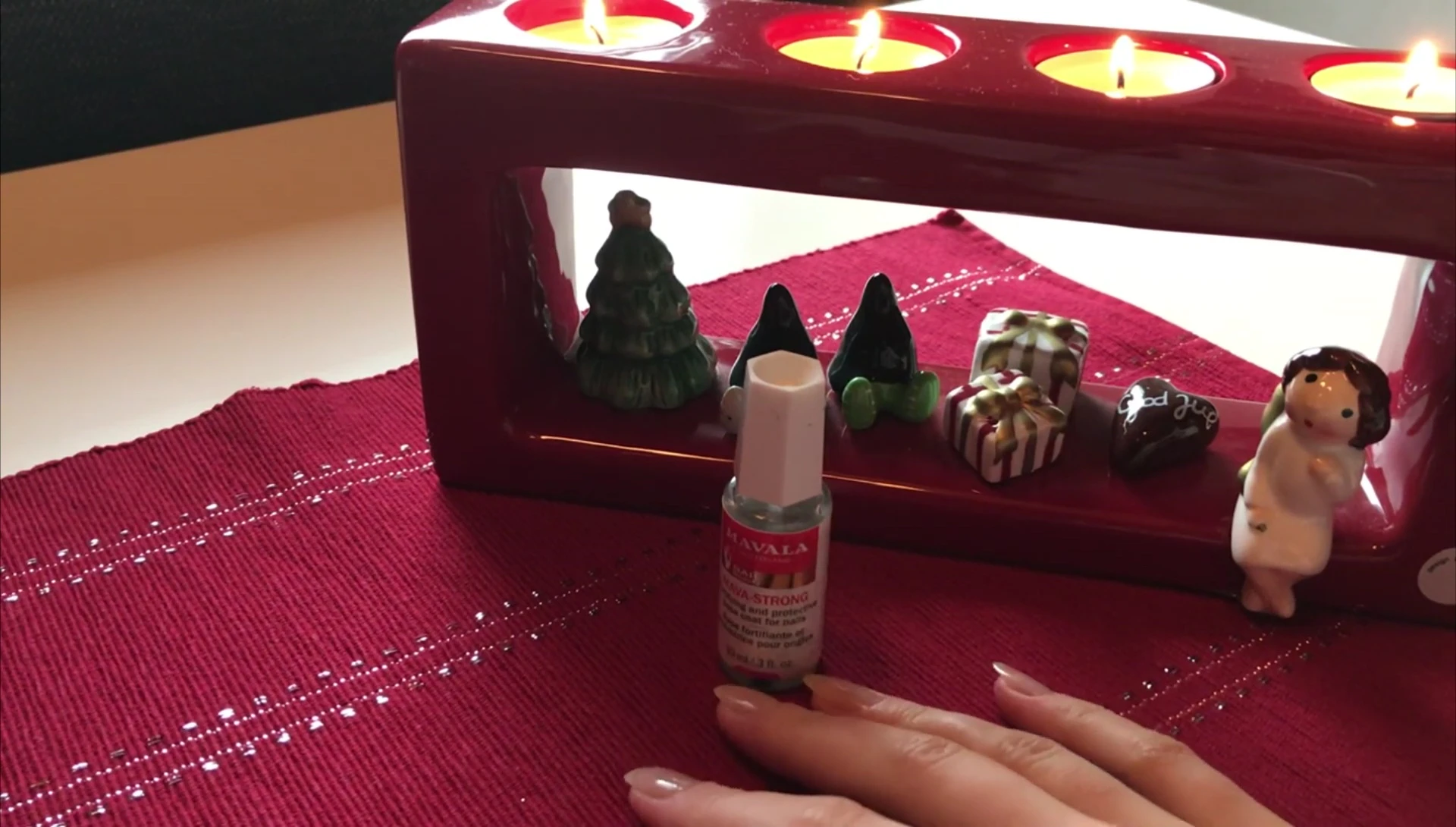 The narrator showing her long, healthy nails.