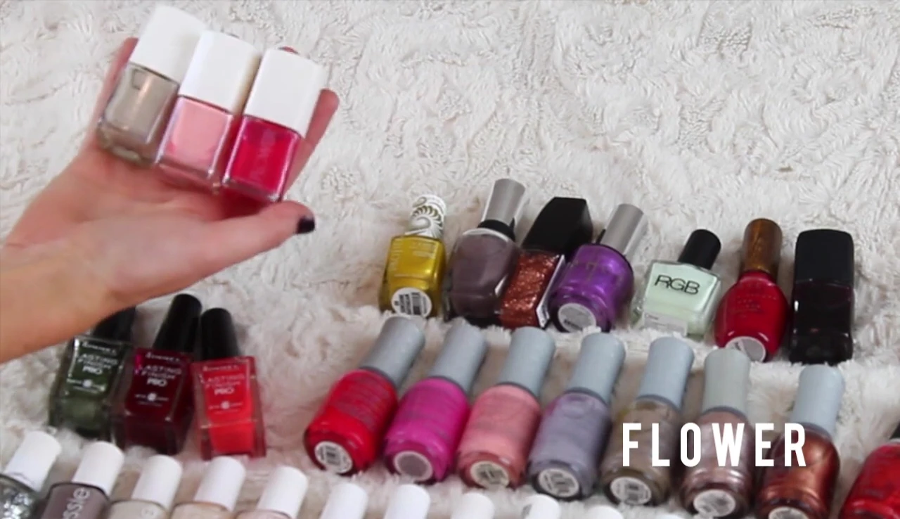 Close-up of three Flower nail polishes by Drew Barrymore.