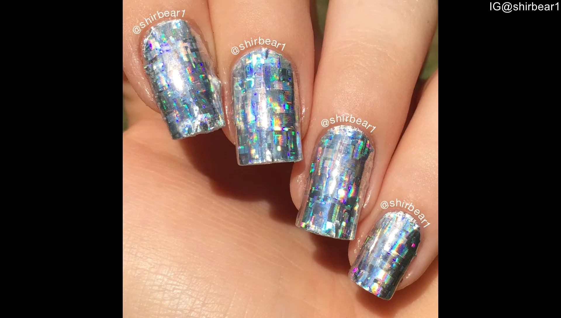 Close-up of the finished nail design showcasing the holographic effect.