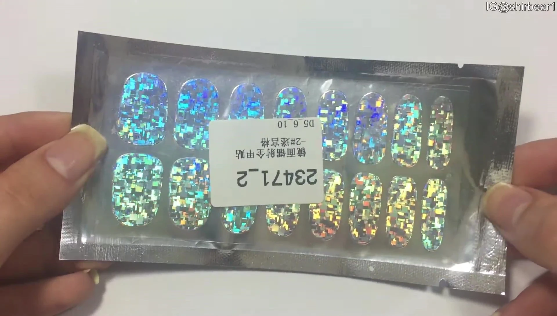 Close-up of the nail sticker packaging showing the different sizes.