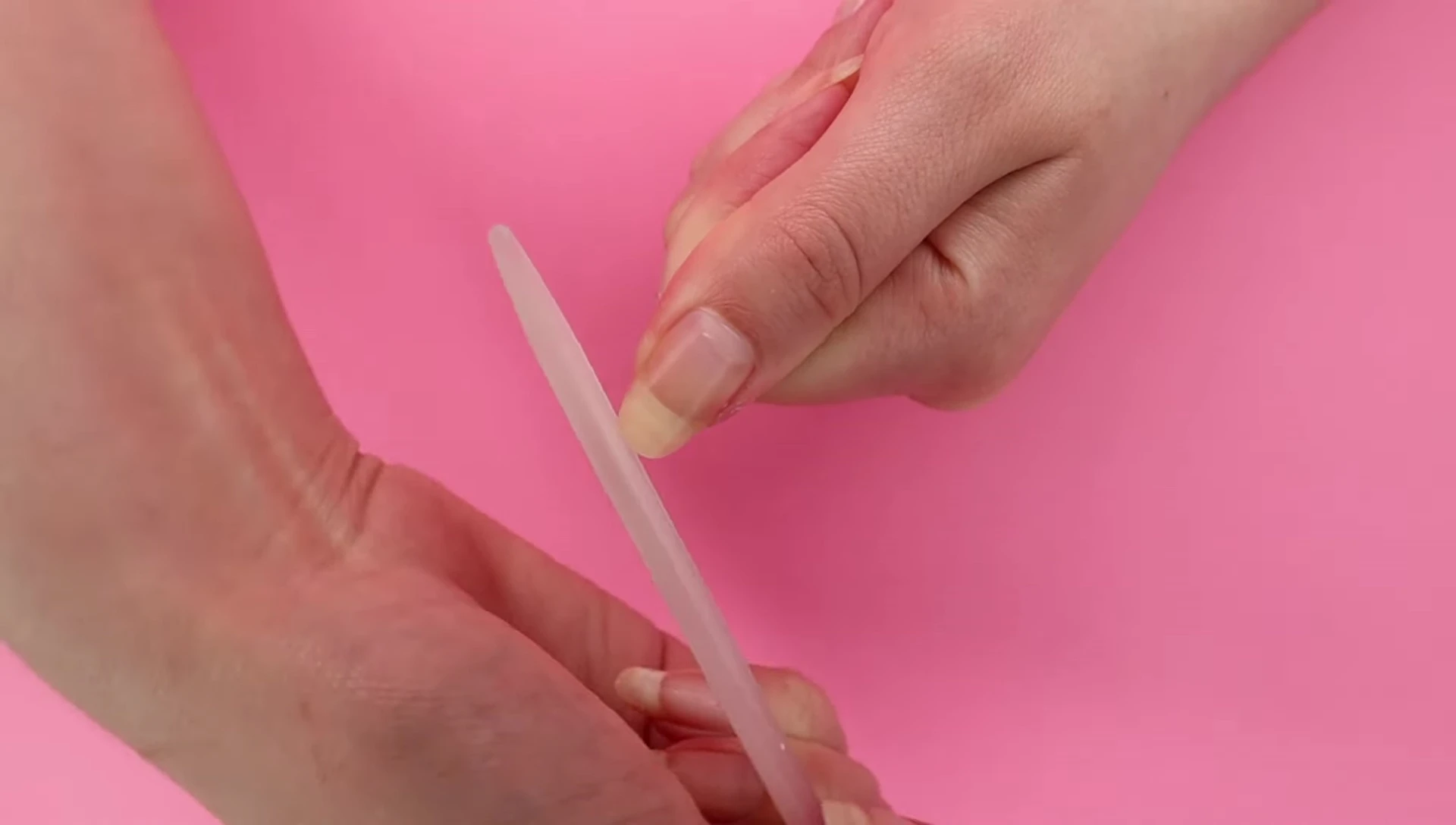 Filing nails into a long almond shape