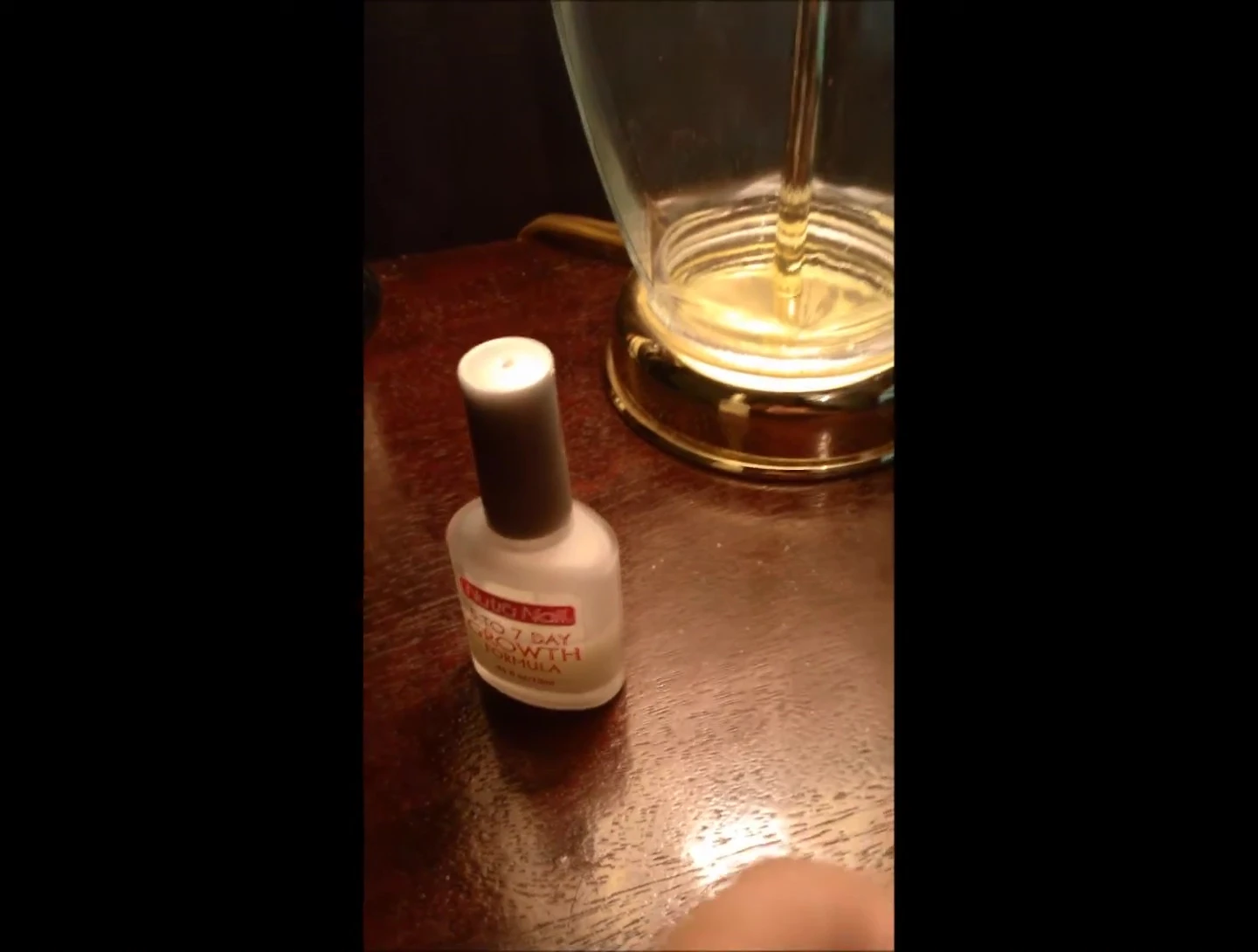 Close-up shot demonstrating the flexibility and bendiness of the reviewer's nails before using the product.