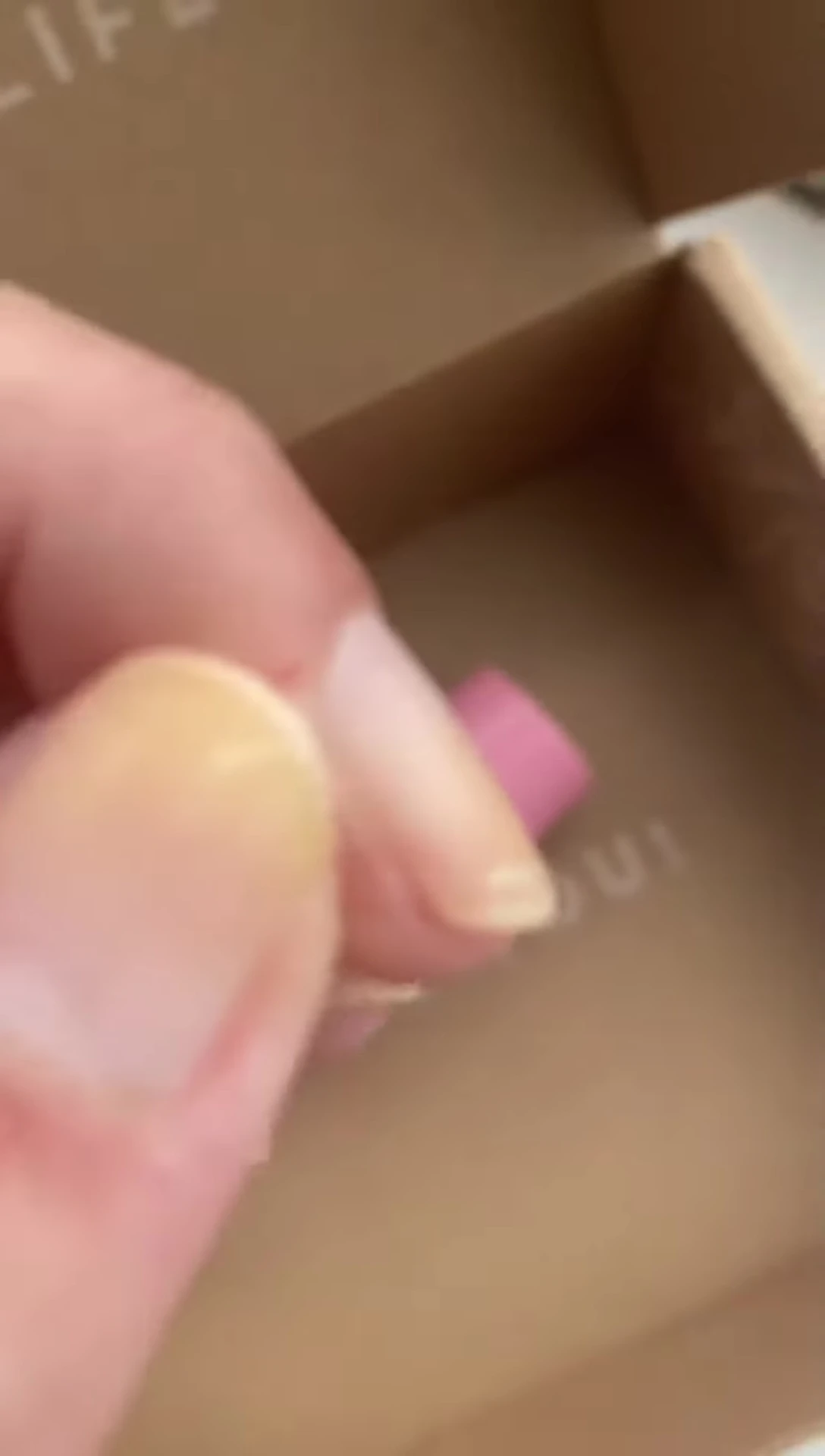 Close-up of nails showcasing ridges before treatment