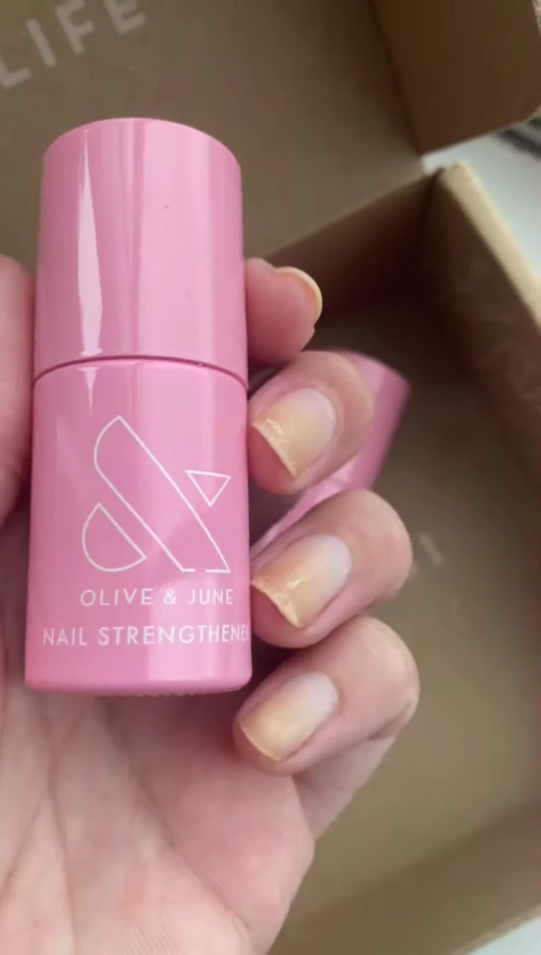 The Olive & June nail strengthener bottle