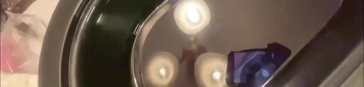 Hands dipped in the melted paraffin wax