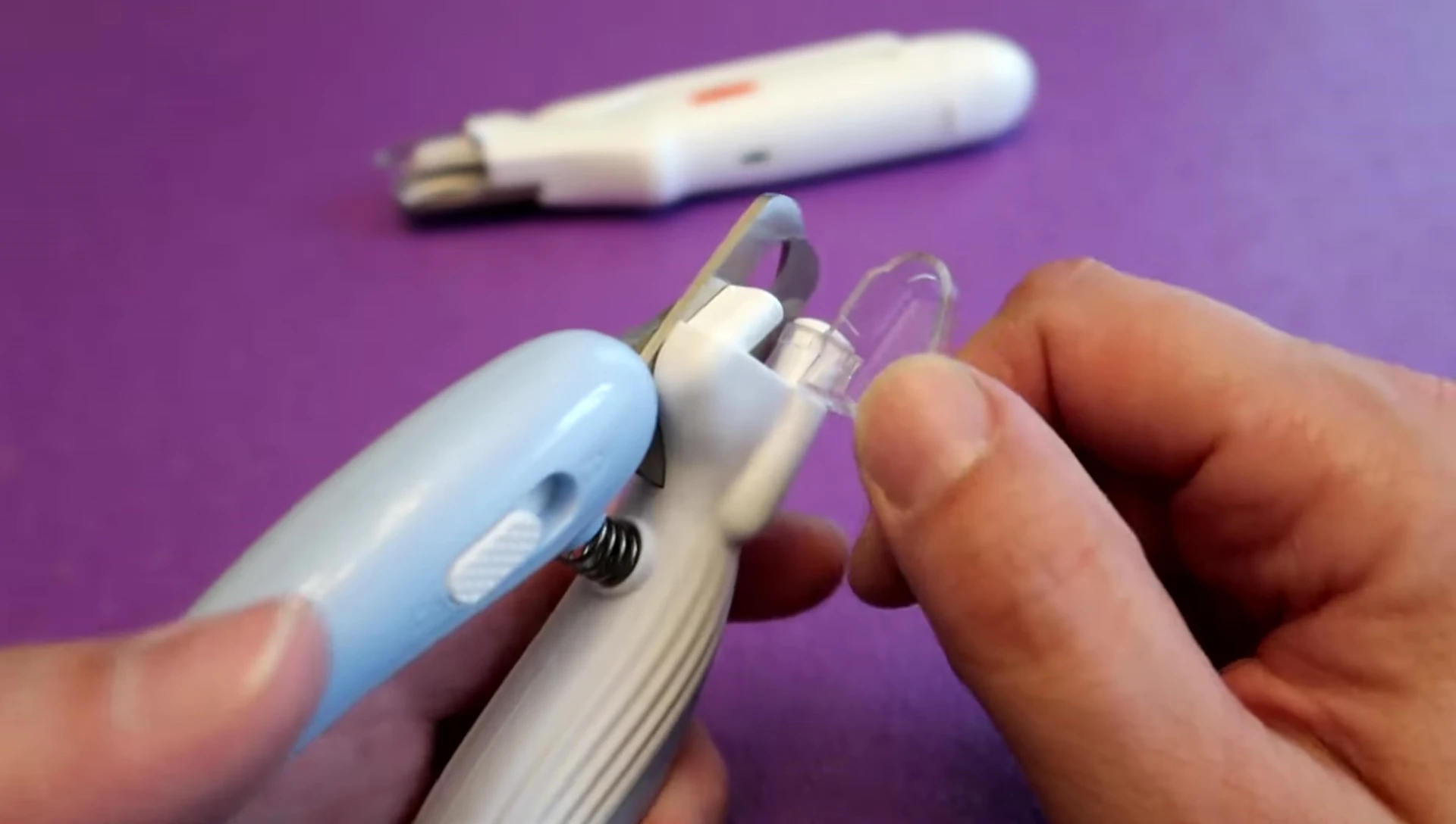 The presenter highlighting the obstructive nail catcher