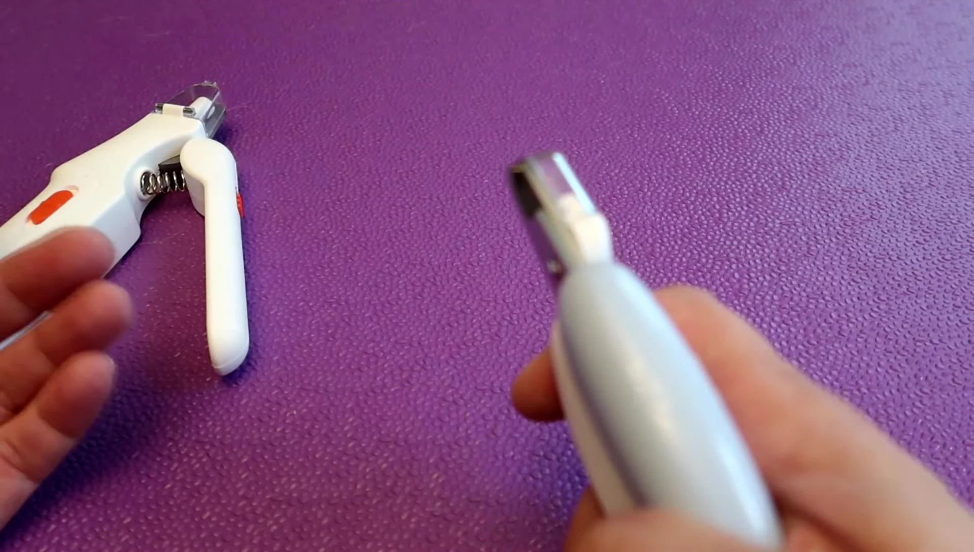 Presenter showing the shortcomings of the LED Nail Clippers.