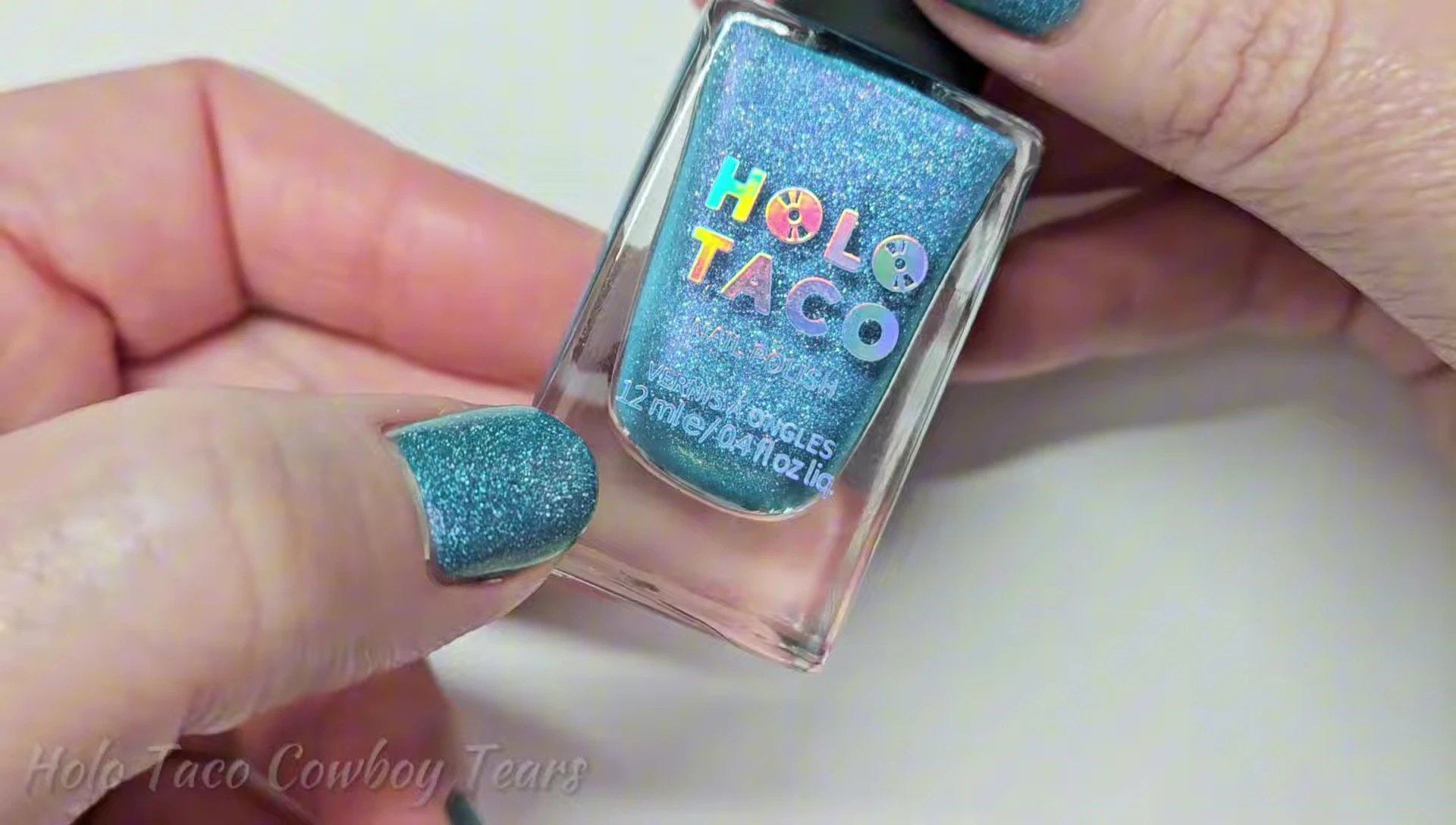 Bottle shot of Holo Taco Cowboy Tears nail polish.