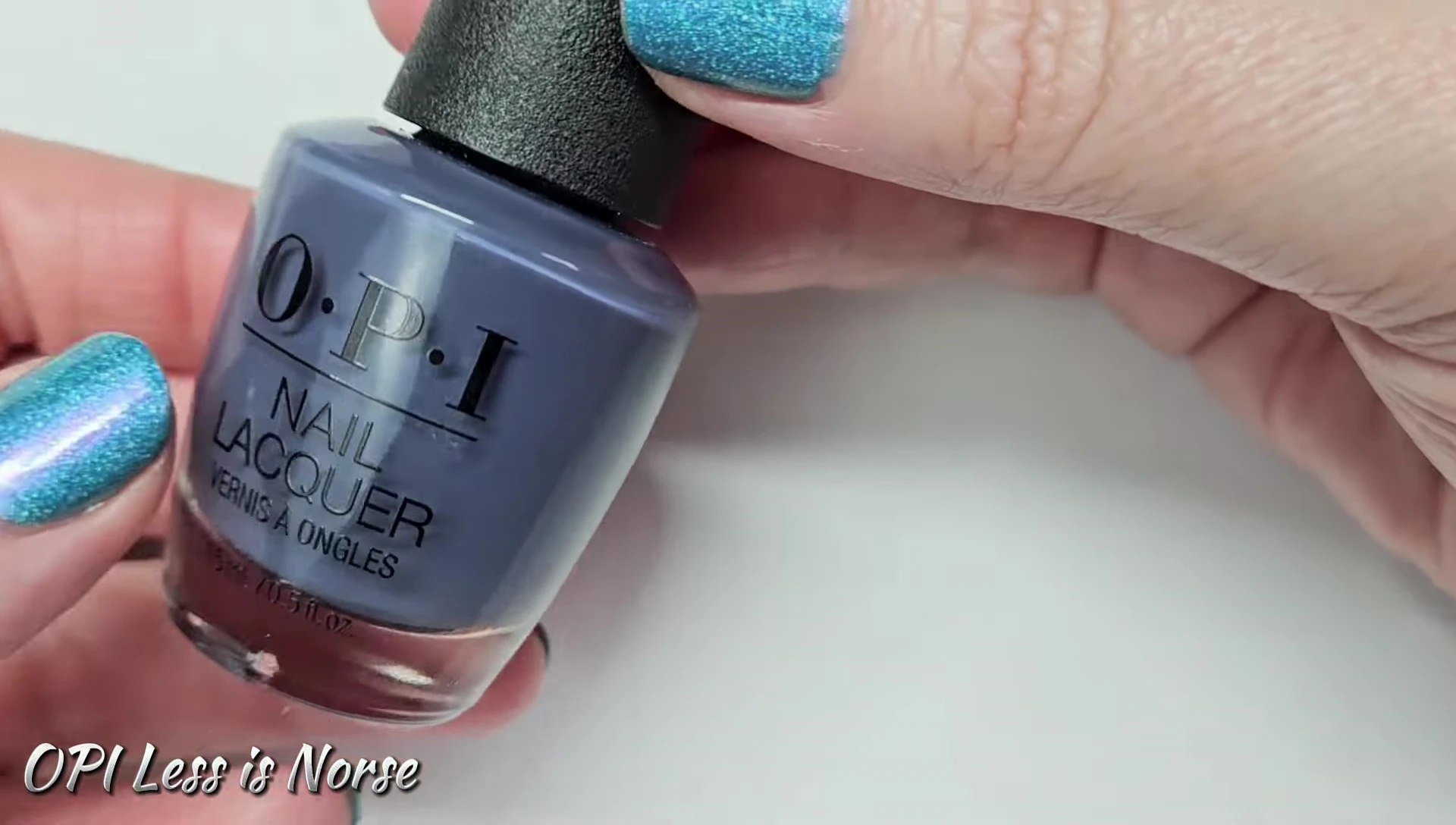 Close-up swatch of OPI Less is Norse on a nail.