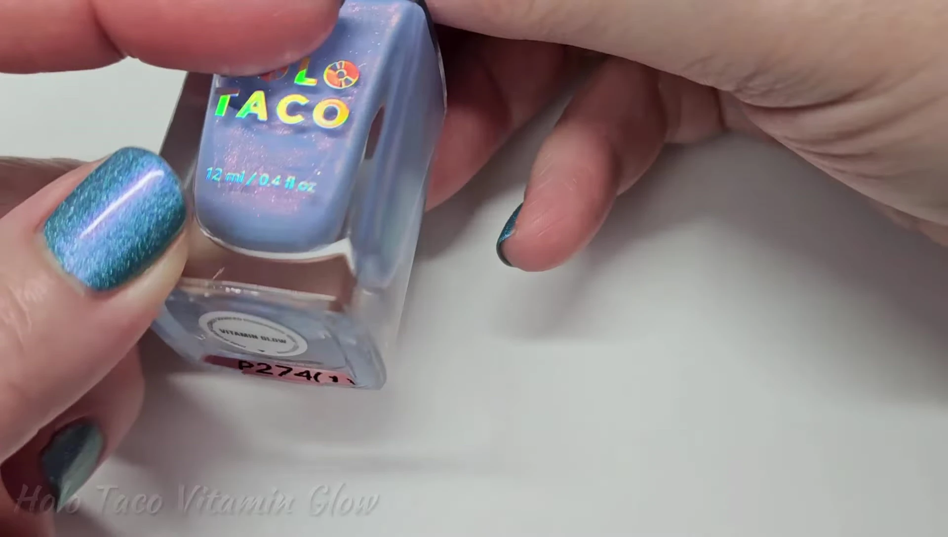 Bottle shot of Holo Taco Vitamin Glow nail polish.