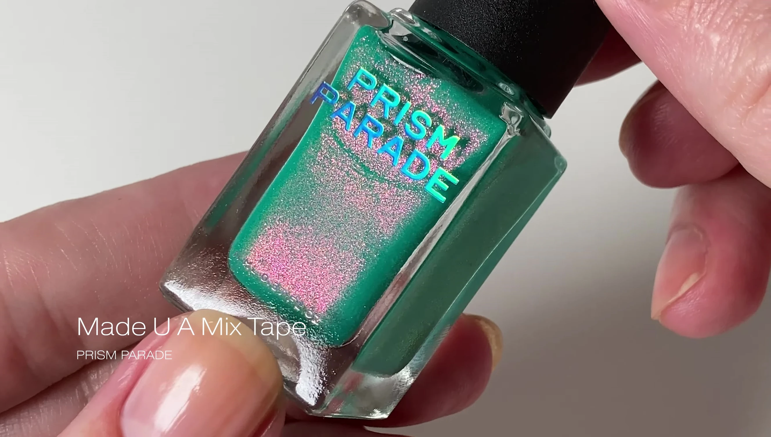 Close-up showcasing the teal color and shifting fuchsia-gold-orange shimmer of Made You a Mixtape polish.