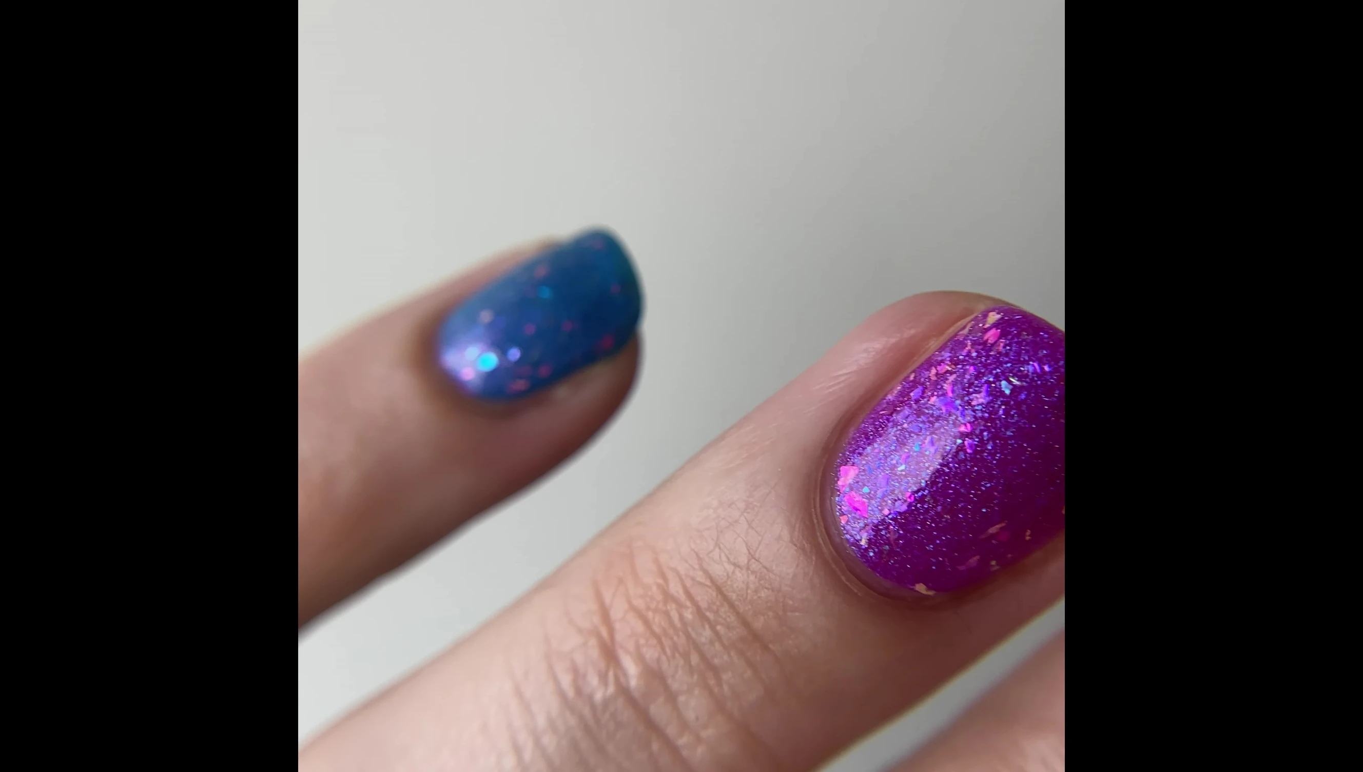 Heart Like a Riot charity polish over a Skittles manicure.