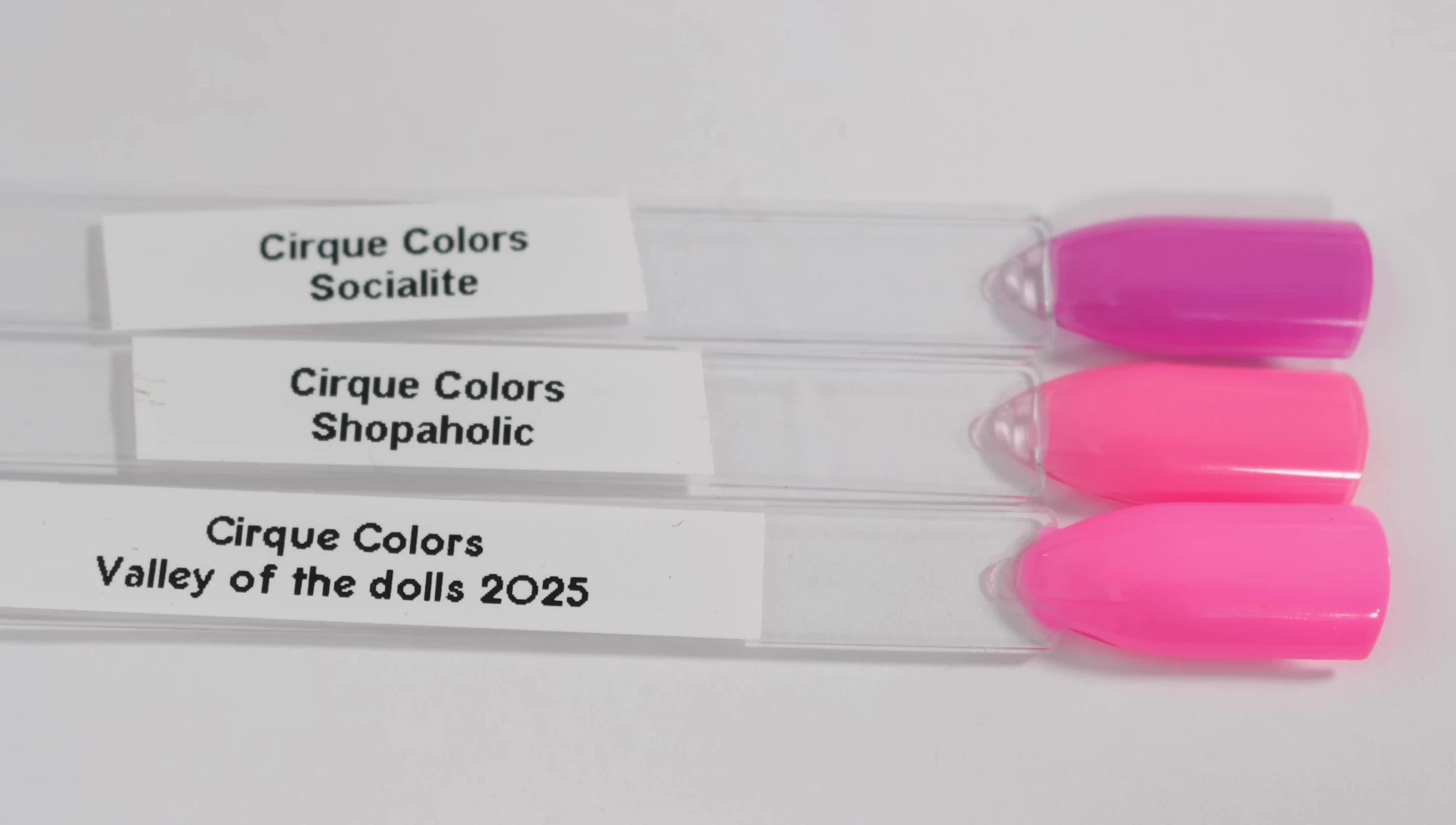 Comparison shots of Valley of the Dolls with other Cirque Colors pinks.