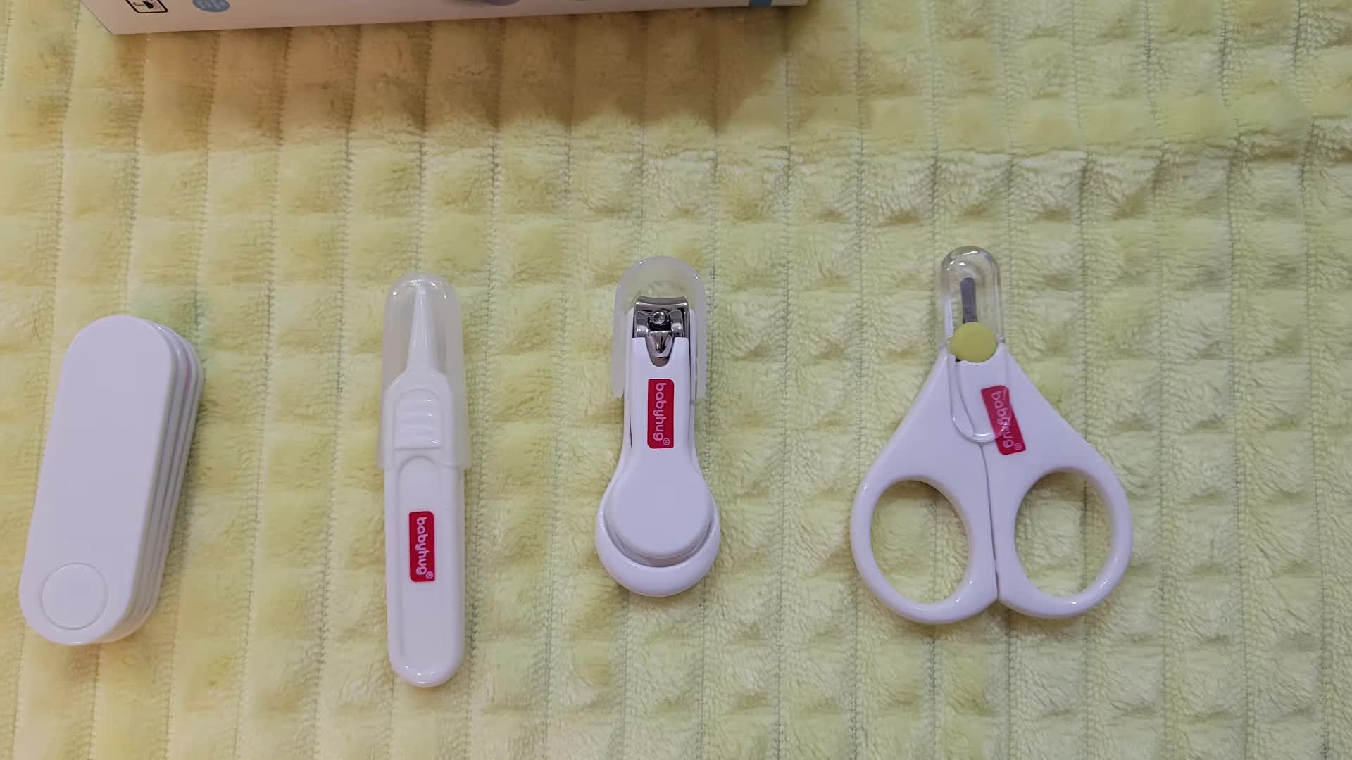 Close-up of the Baby Hug nail clipper set.