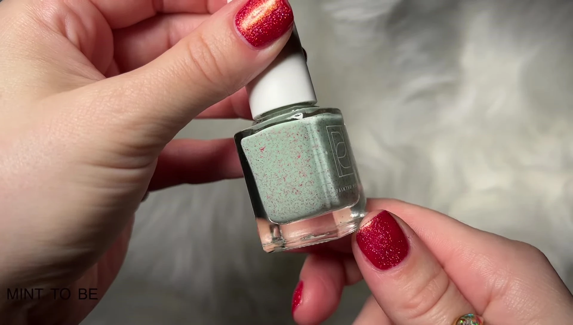 Mint to Be swatches showcasing the red metallic flakes against the mint base.