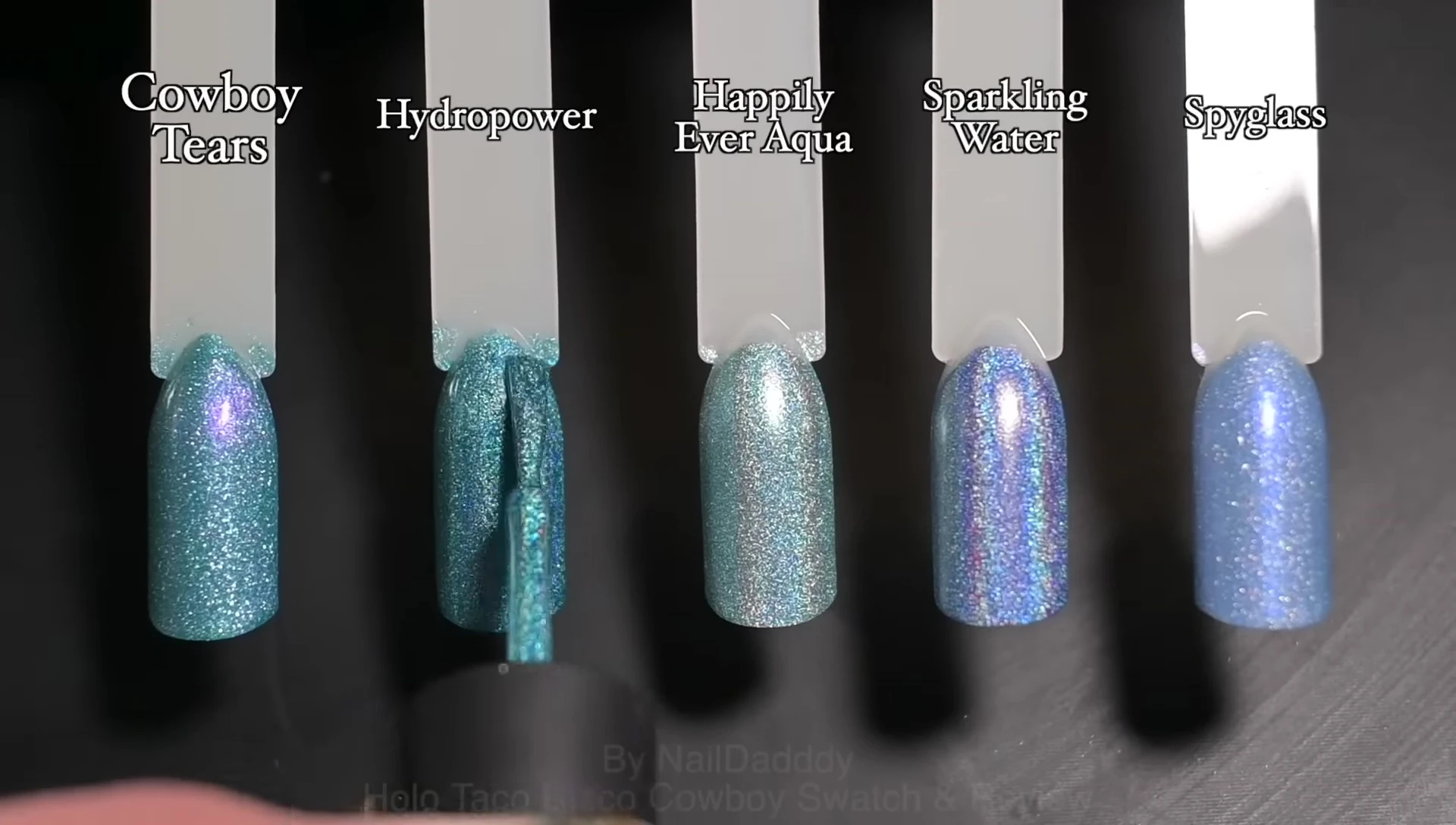 Comparison swatches of Cowboy Tears with other blue and holographic polishes.