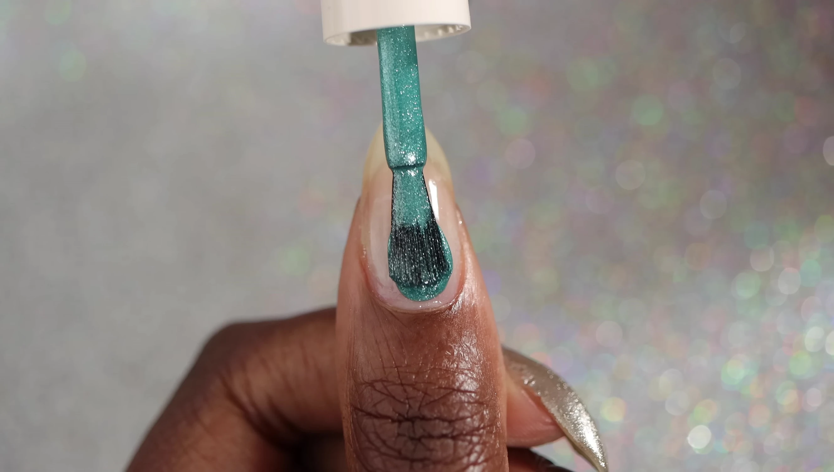 Close-up of Vajour nail polish bottle and swatch.