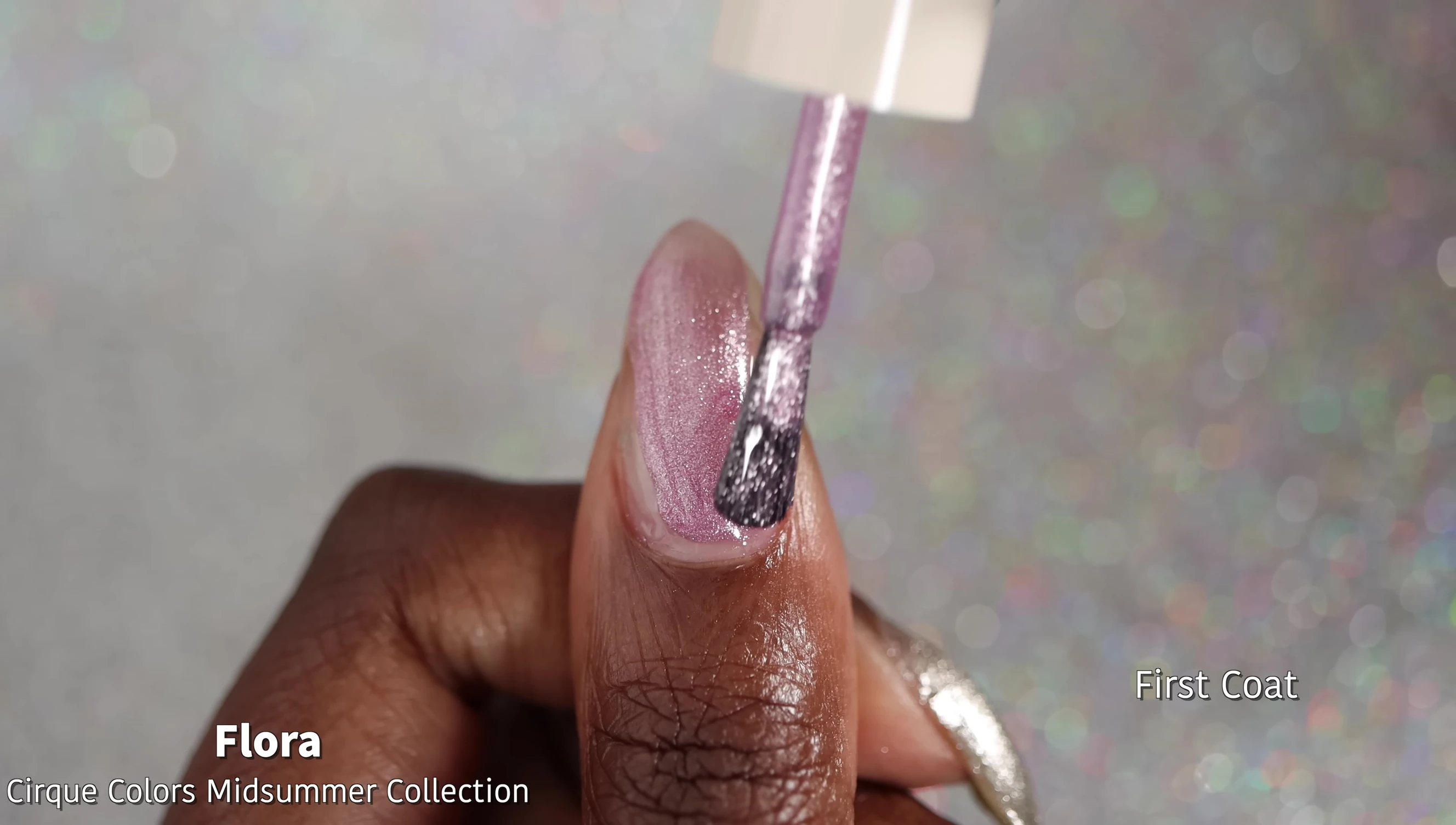 Close-up of Flora nail polish bottle and swatch.