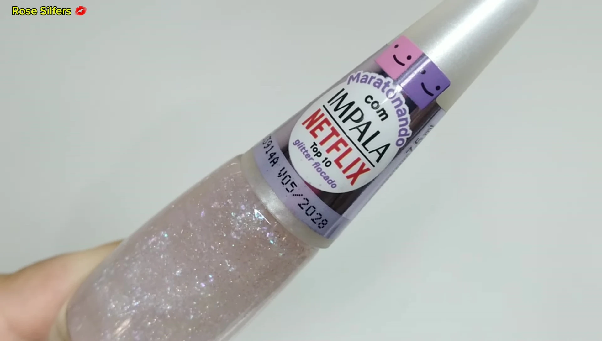 Close-up of Top 10 glitter nail polish bottle