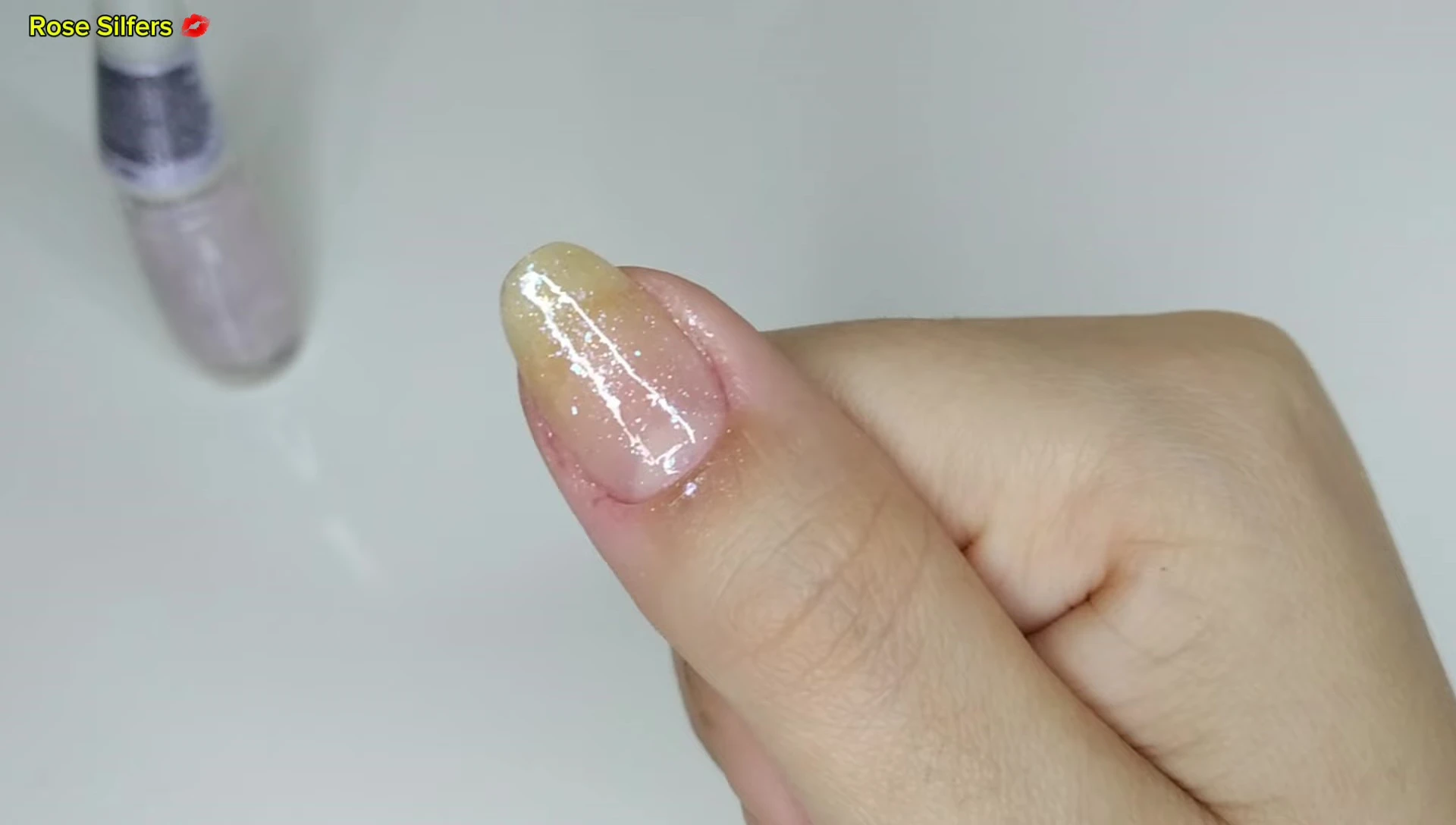 Nail with two coats of Top 10 glitter