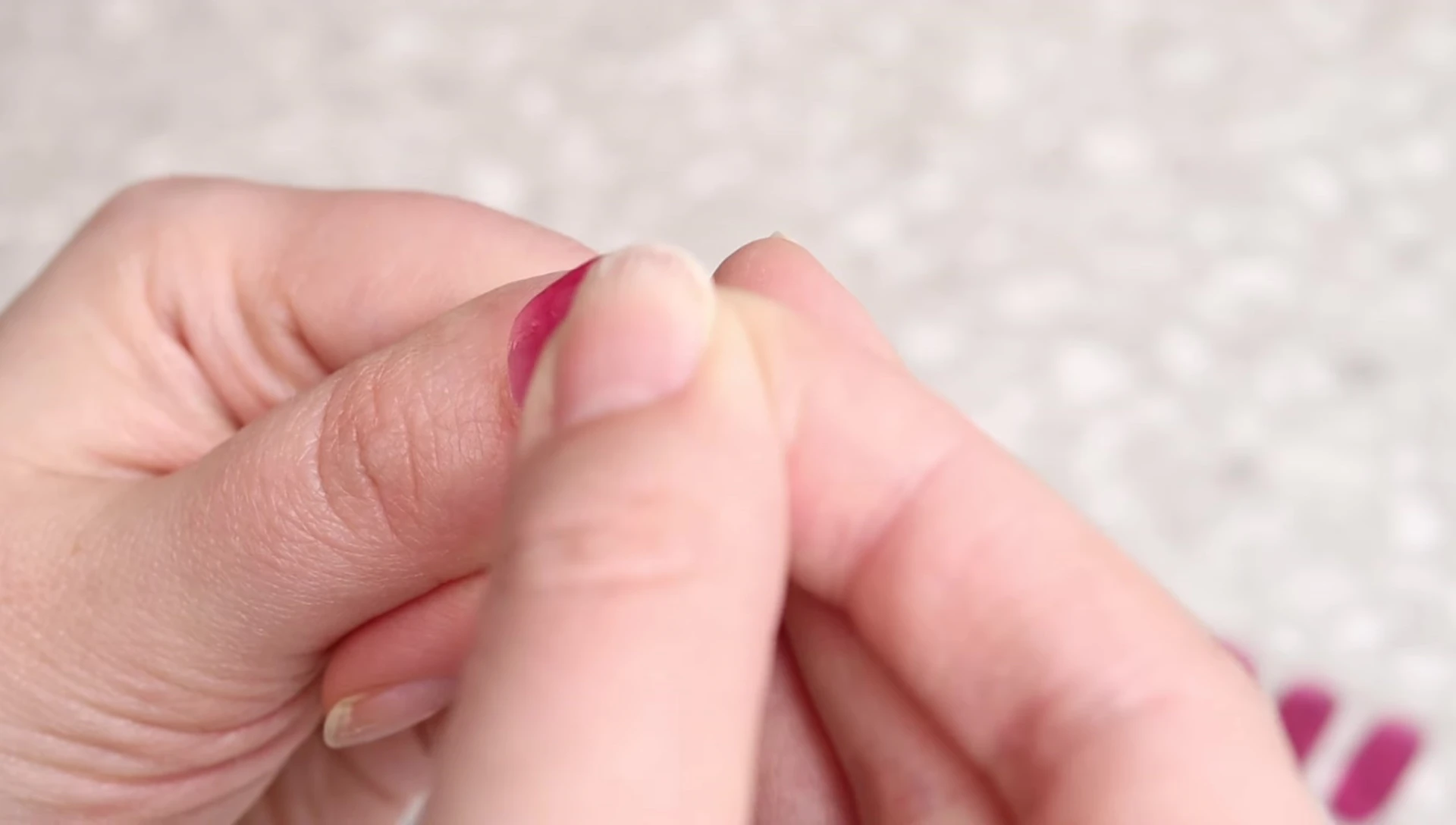 Applying the nail strip and smoothing with finger