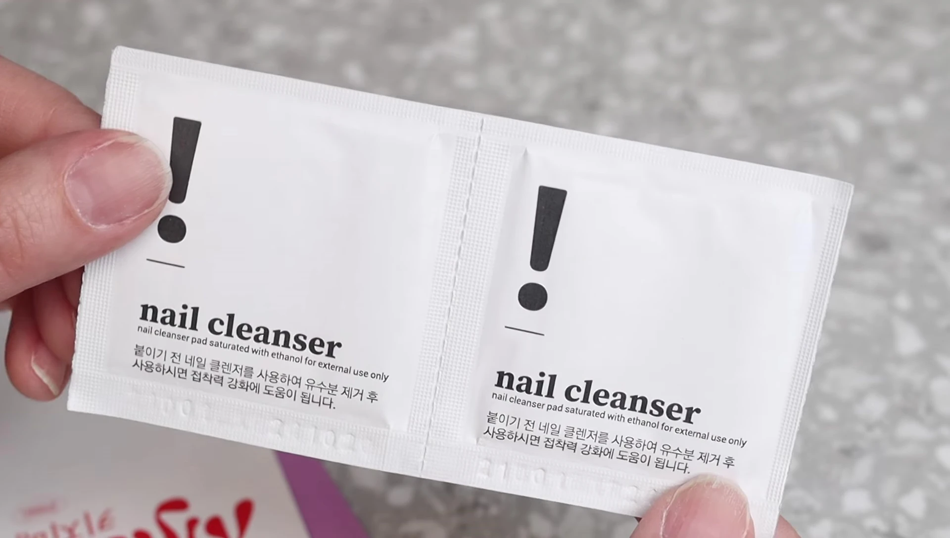 Kijibae package contents: cuticle pusher, wipes, and instruction booklet