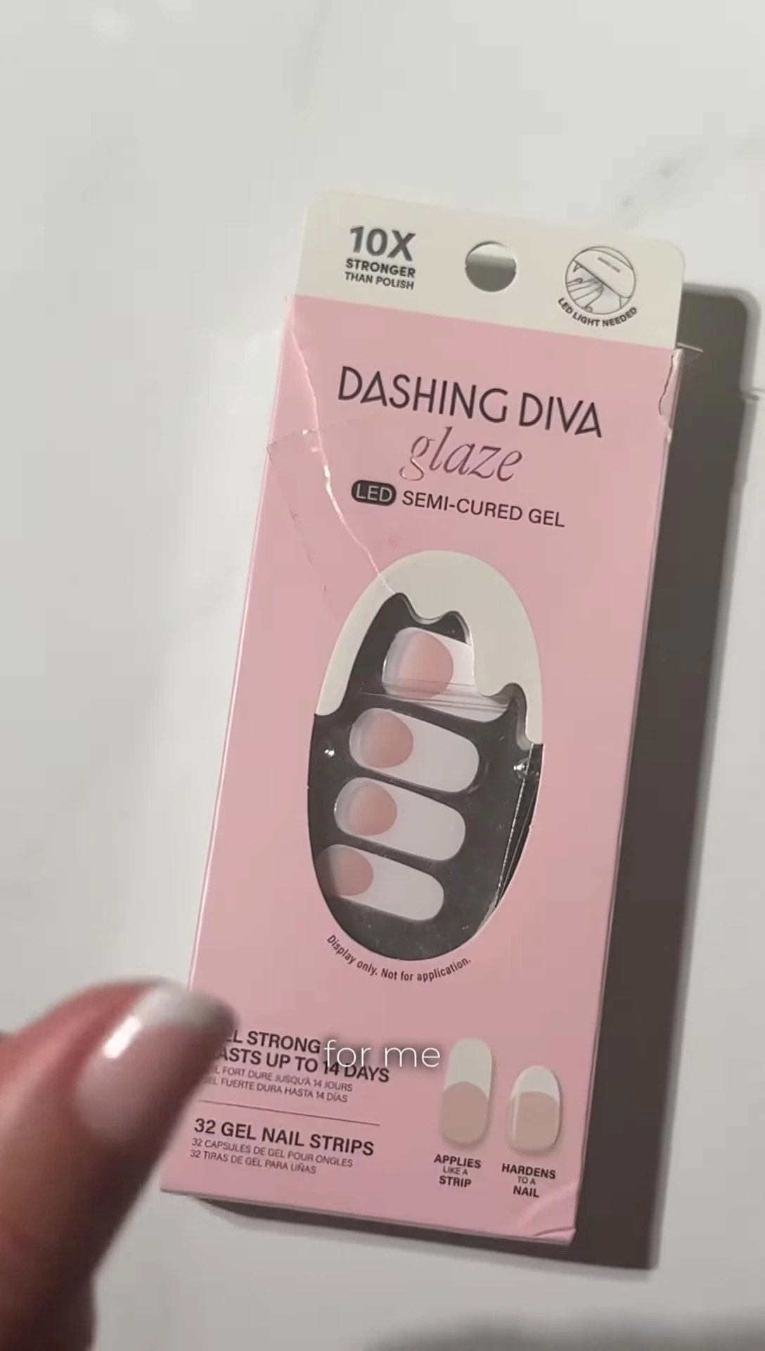 Hand showing nail stickers