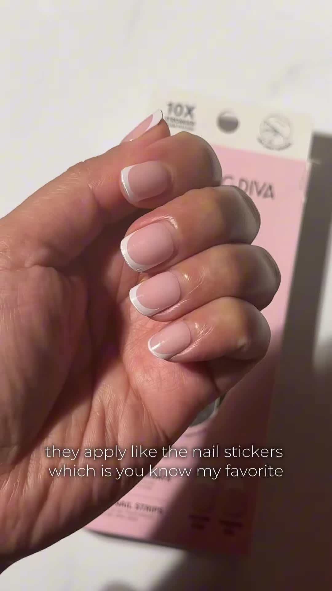 Close-up shot of the nail stickers being applied
