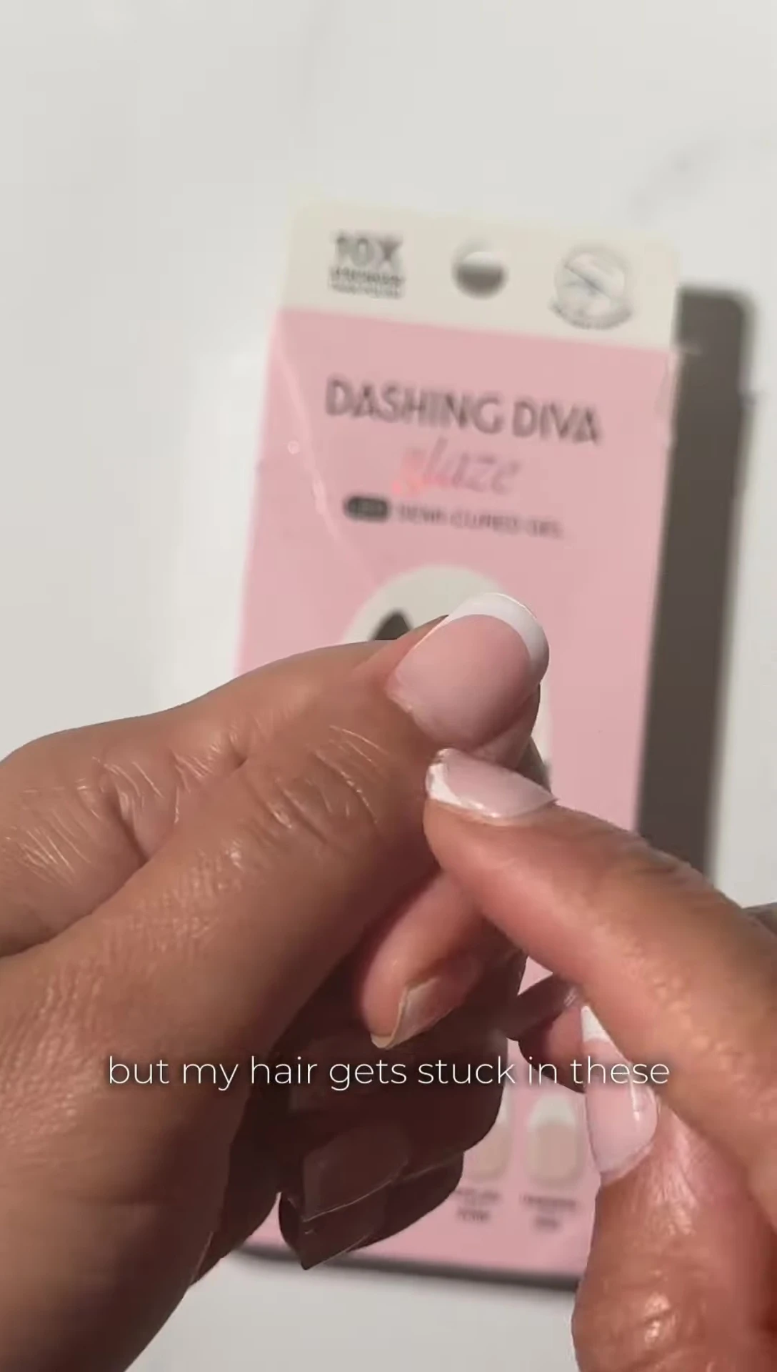 Hand showing hair caught in the nail