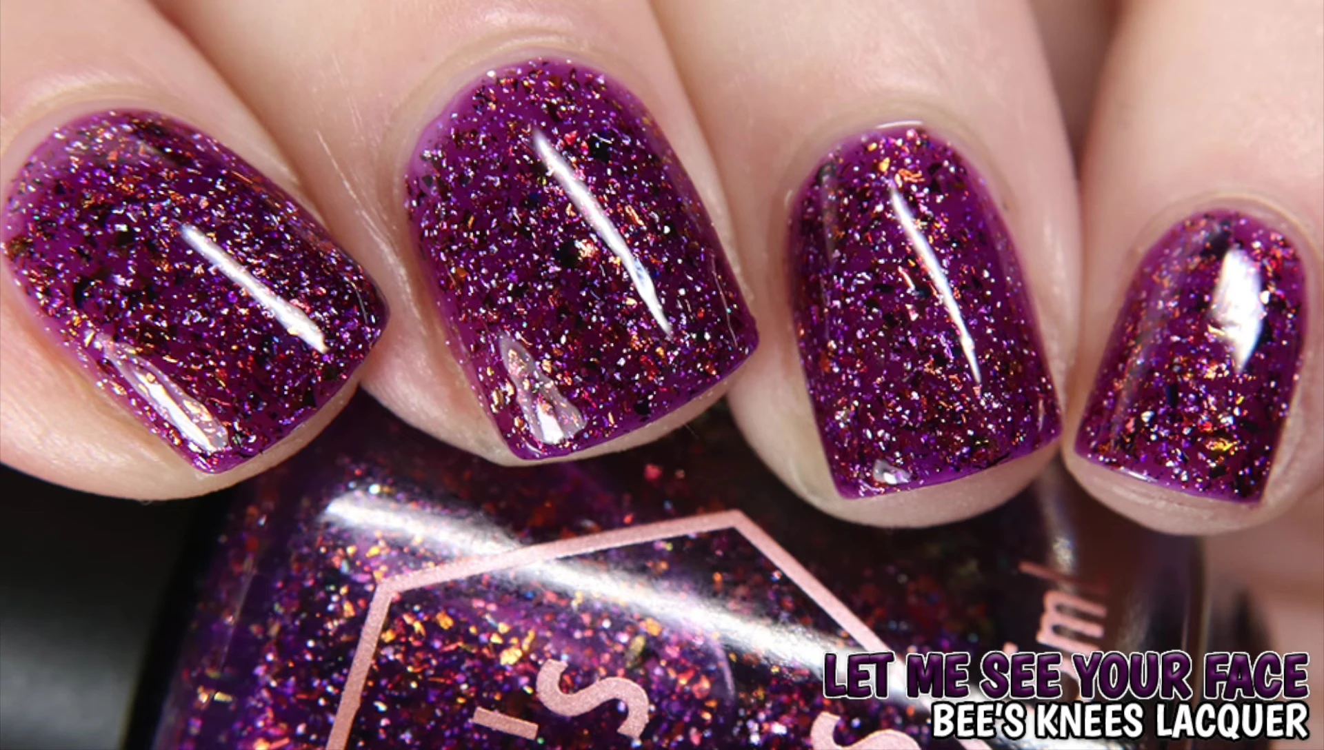 Close-up shot of Bees Lacquer polish on nails under bright lighting