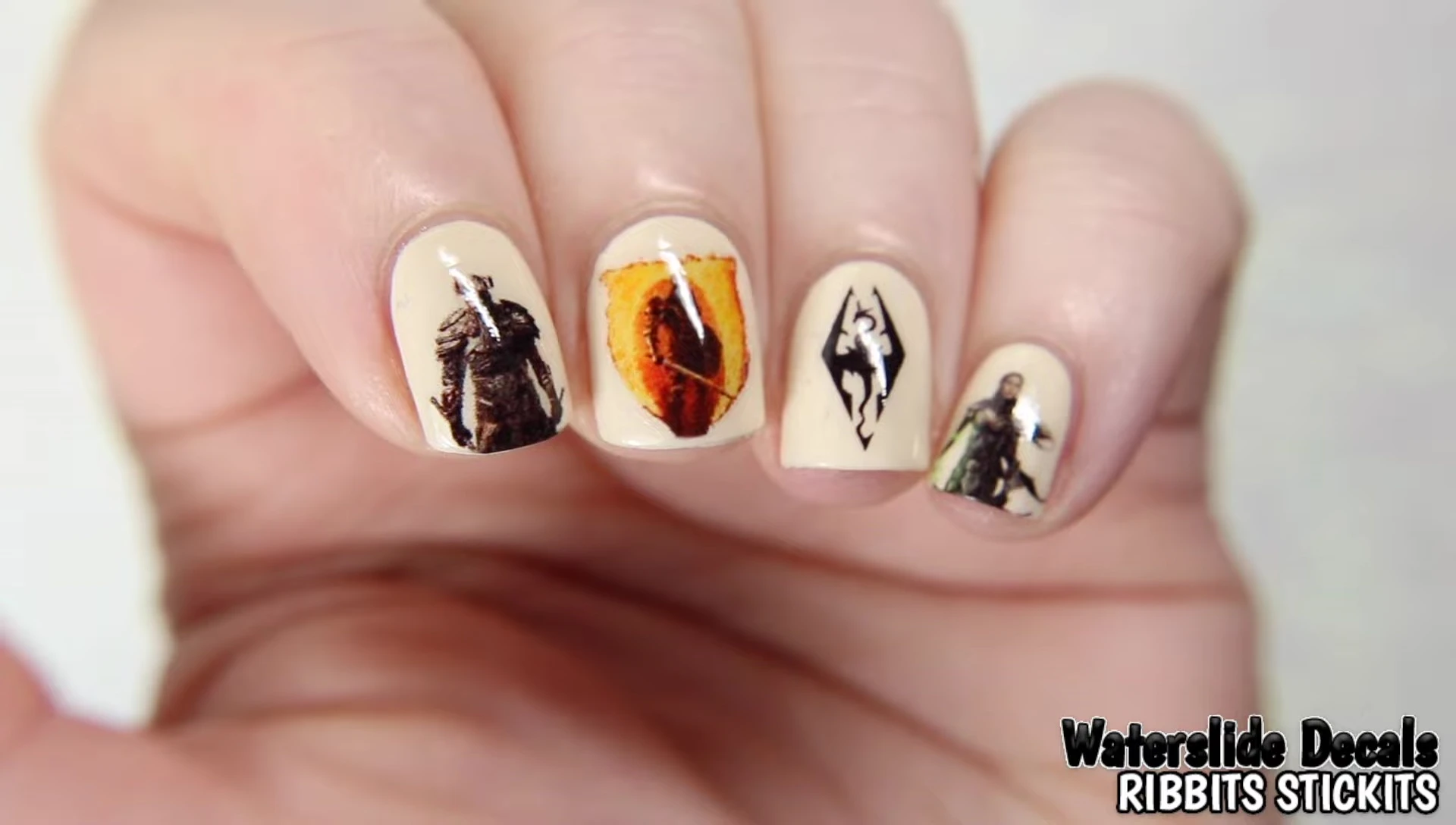 Nail art using the Ribbit Sticks water slide decals on light tan cream