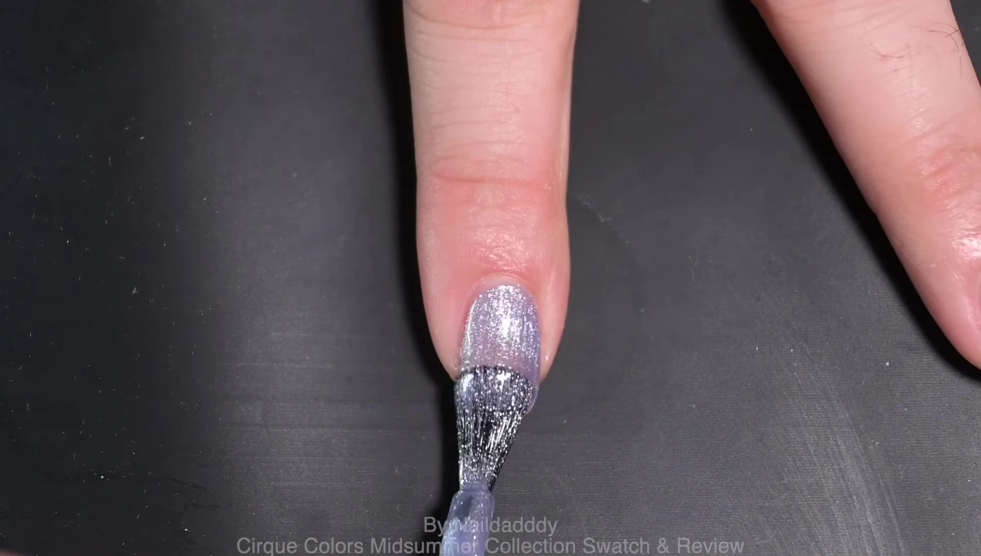 Close-up shot of Lush swatch on a nail.