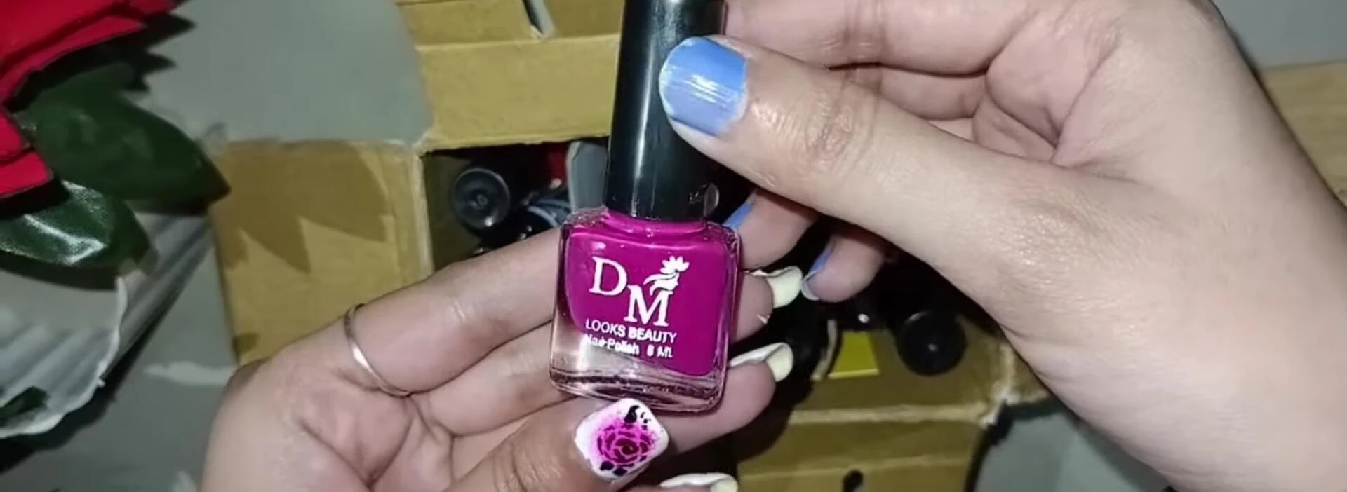 Close-up of the pink nail polish.