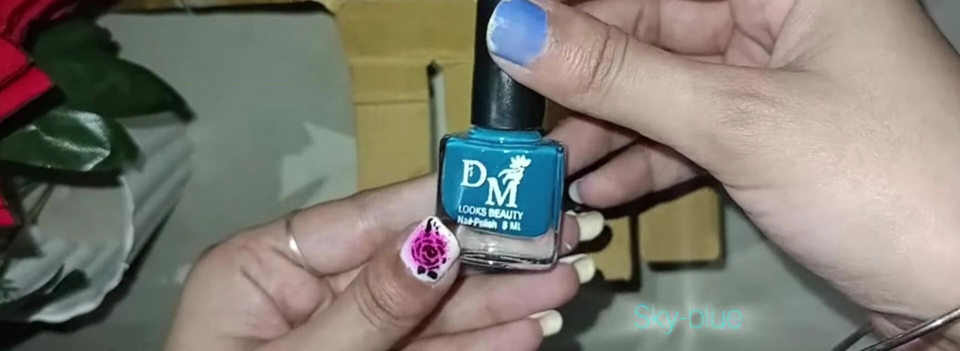 Close-up of the sky blue nail polish.