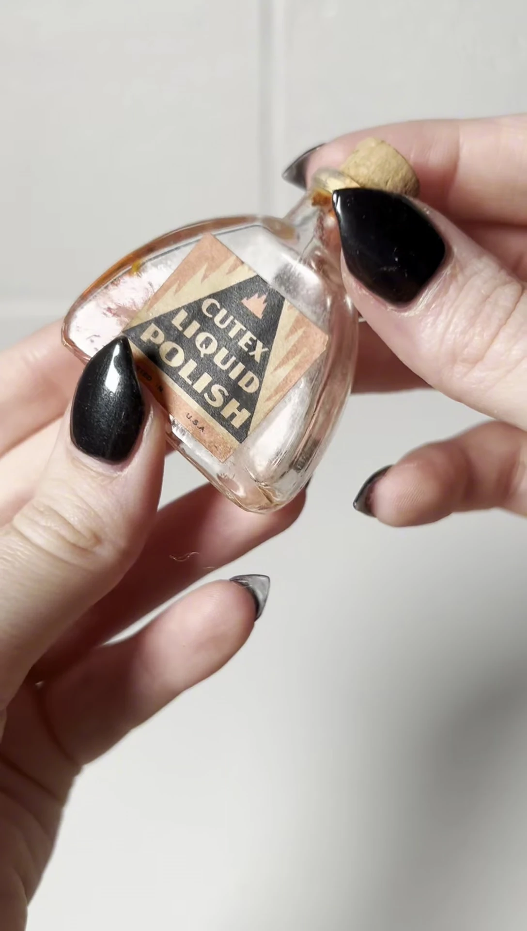 The vintage Q-tex nail polish bottle